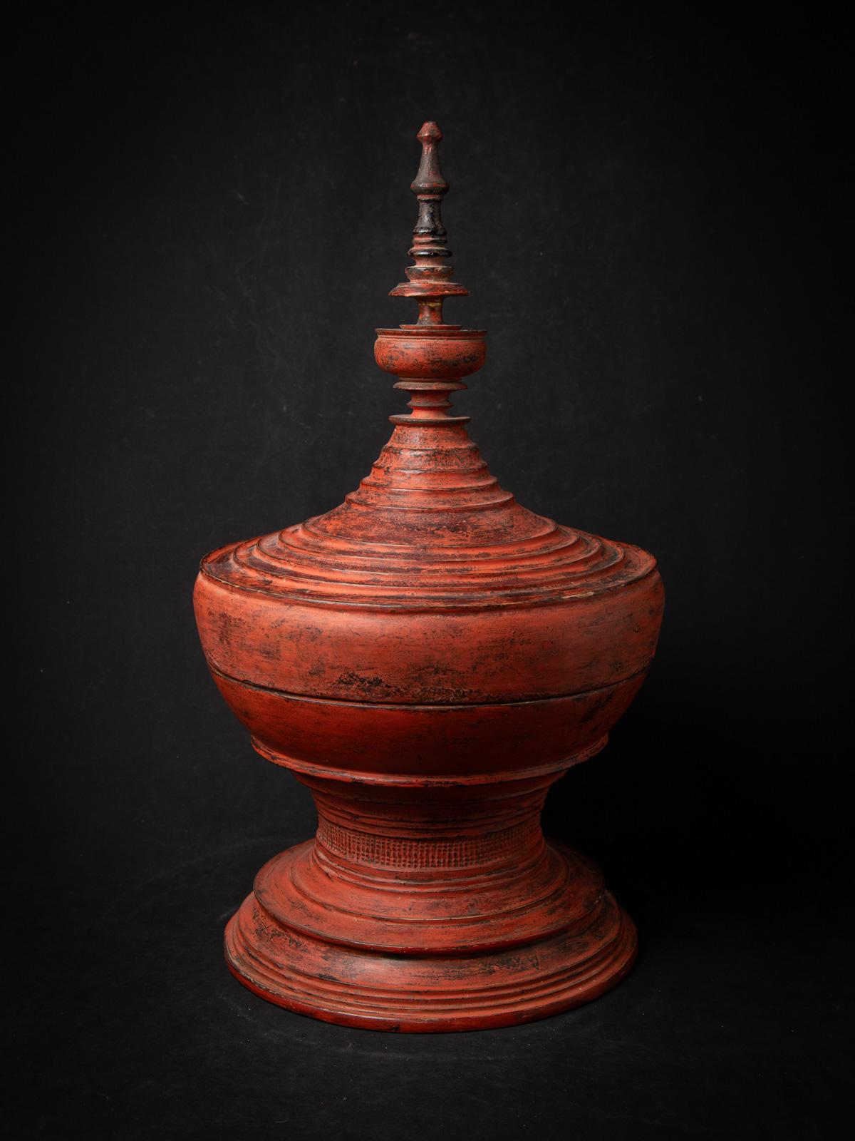 This Antique Wooden Burmese Offering Vessel is a remarkable piece that beautifully showcases the craftsmanship of the Shan (Tai Yai) people. Crafted from high-quality wood, this vessel stands 68 cm tall and has a diameter of 37.5 cm, making it an