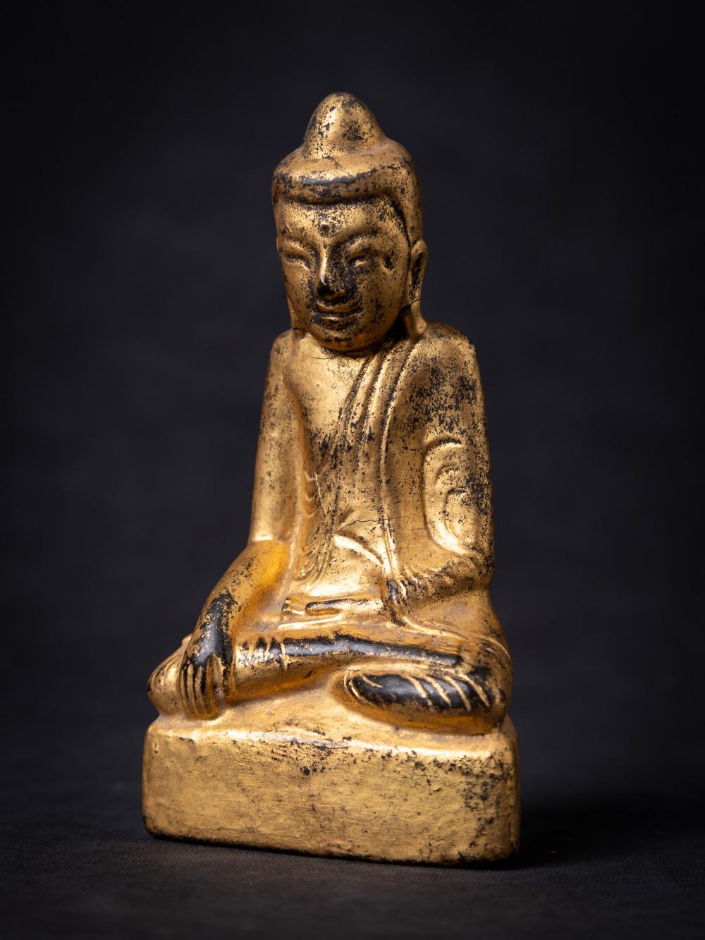 This exquisite wooden Buddha statue, hailing from 19th century Burma, is a true masterpiece of artistic and spiritual expression. Standing at a height of 13.4 cm with dimensions of 7 cm in width and 3.7 cm in depth, this statue exudes a sense of