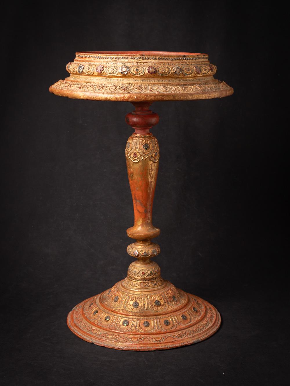 Elevate your space with this antique wooden Burmese stand, a stunning 19th-century artifact crafted in the Mandalay style. Made from solid wood and gilded with 24-karat gold, this exquisite stand stands 60.5 cm high with a 40 cm diameter and weighs