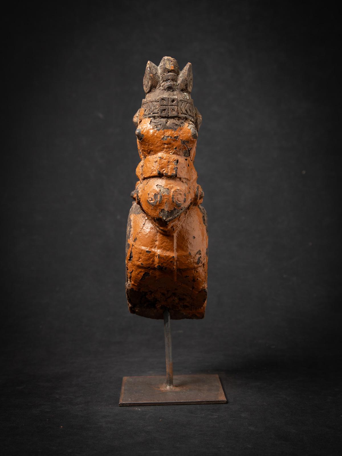 This antique wooden temple fragment of a horse head is a rare and evocative piece of 18th-century Indian temple art, showcasing the refined craftsmanship of the period. Carved from wood, it stands 40.2 cm high, 12.5 cm wide, and 20 cm deep, with a