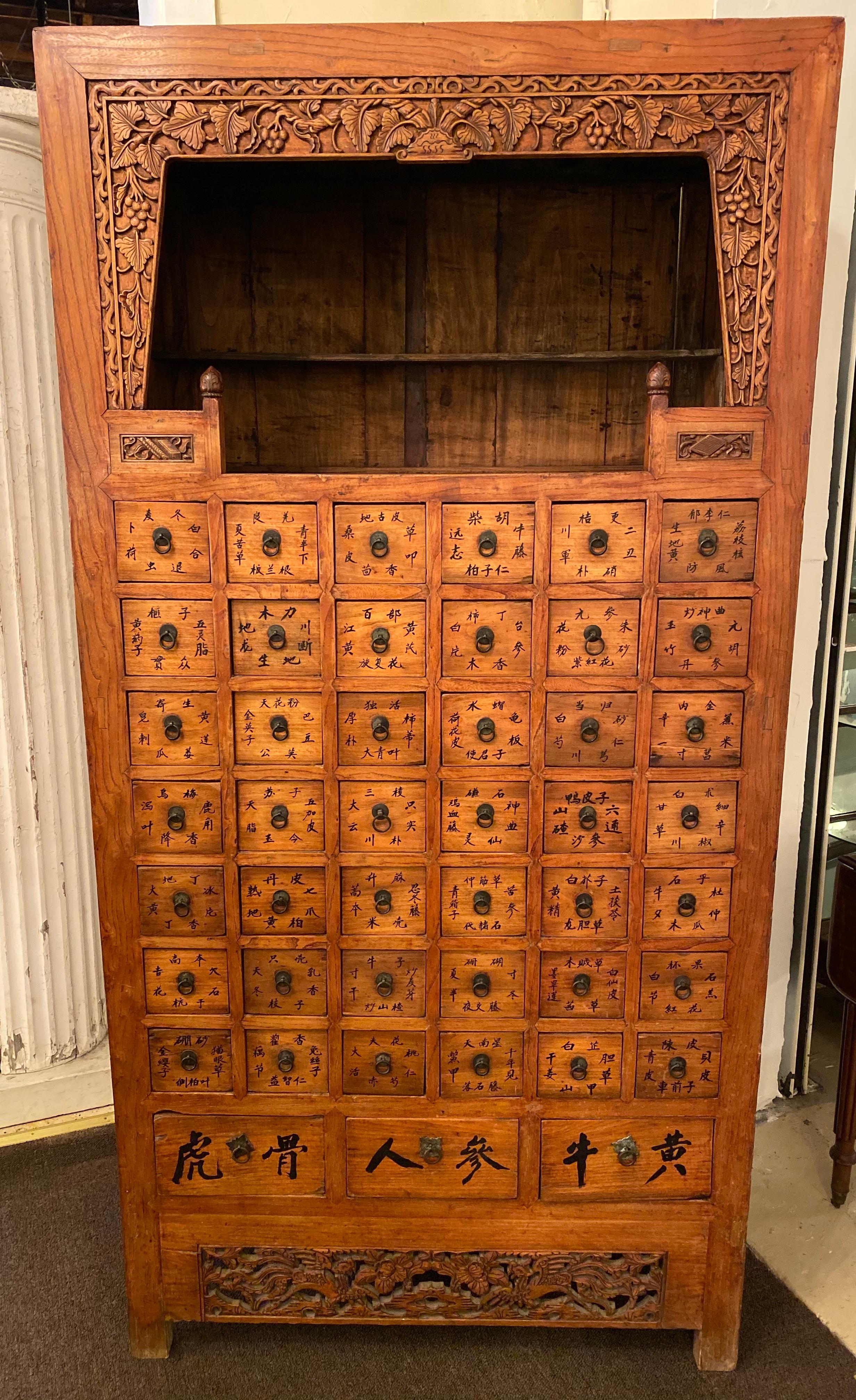 19th century apothecary cabinet having 45 drawers. Large and impressive. This fine cabinet is from the late
19th or early 20th century Ming style herbal cabinet, from Northern China. The top opening has serpentine carving (a little filigree) on