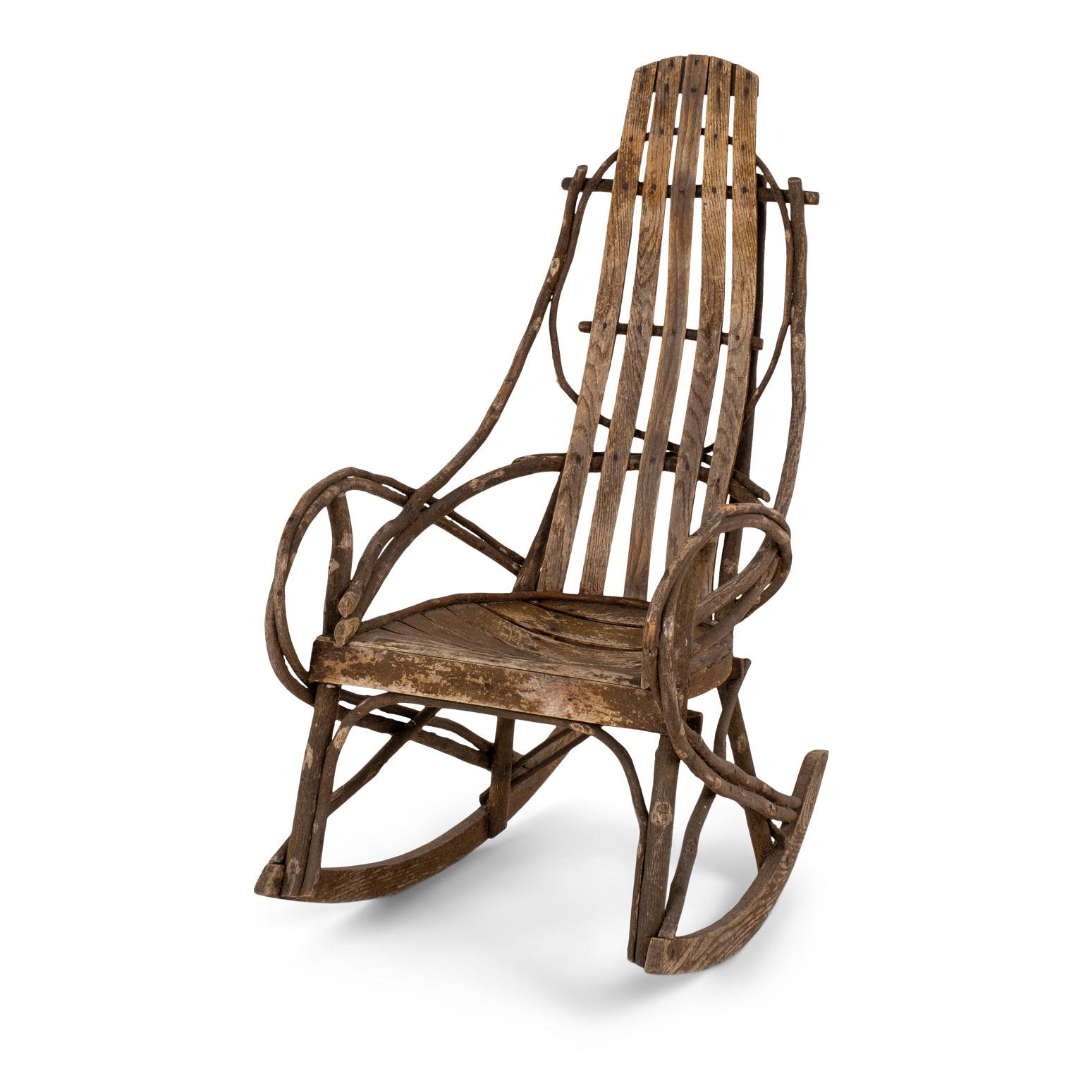 19th century Appalachian rocking chair constructed from twigs, bentwood and an oak seat. Faint remnants of old paint. Excellent condition and beautiful natural patina.