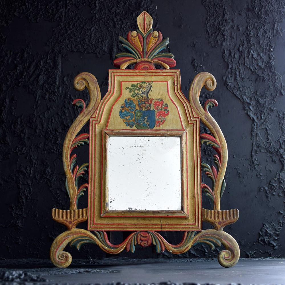 19th century armorial crest wall mirror

We share what we love, and we love the decorative appeal of this mid-19th century pine hand carved / painted wall mirror with armorial crest. With its original mirror glass plate, this item completely