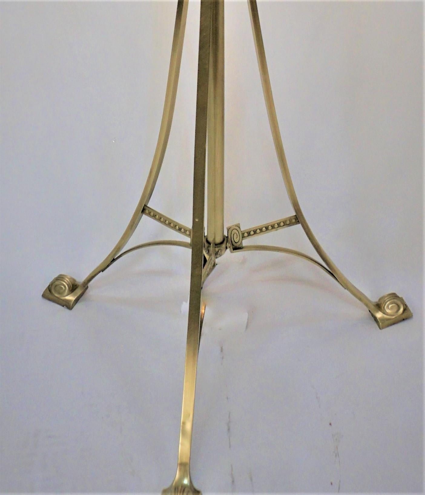 19th Century bronze art nouveau electrified oil lamp base piano floor lamp (oil container has been removed).
This simple but elegant floor lamp has adjustable height with three pull chain sockets.
Measurement includes the lampshade.