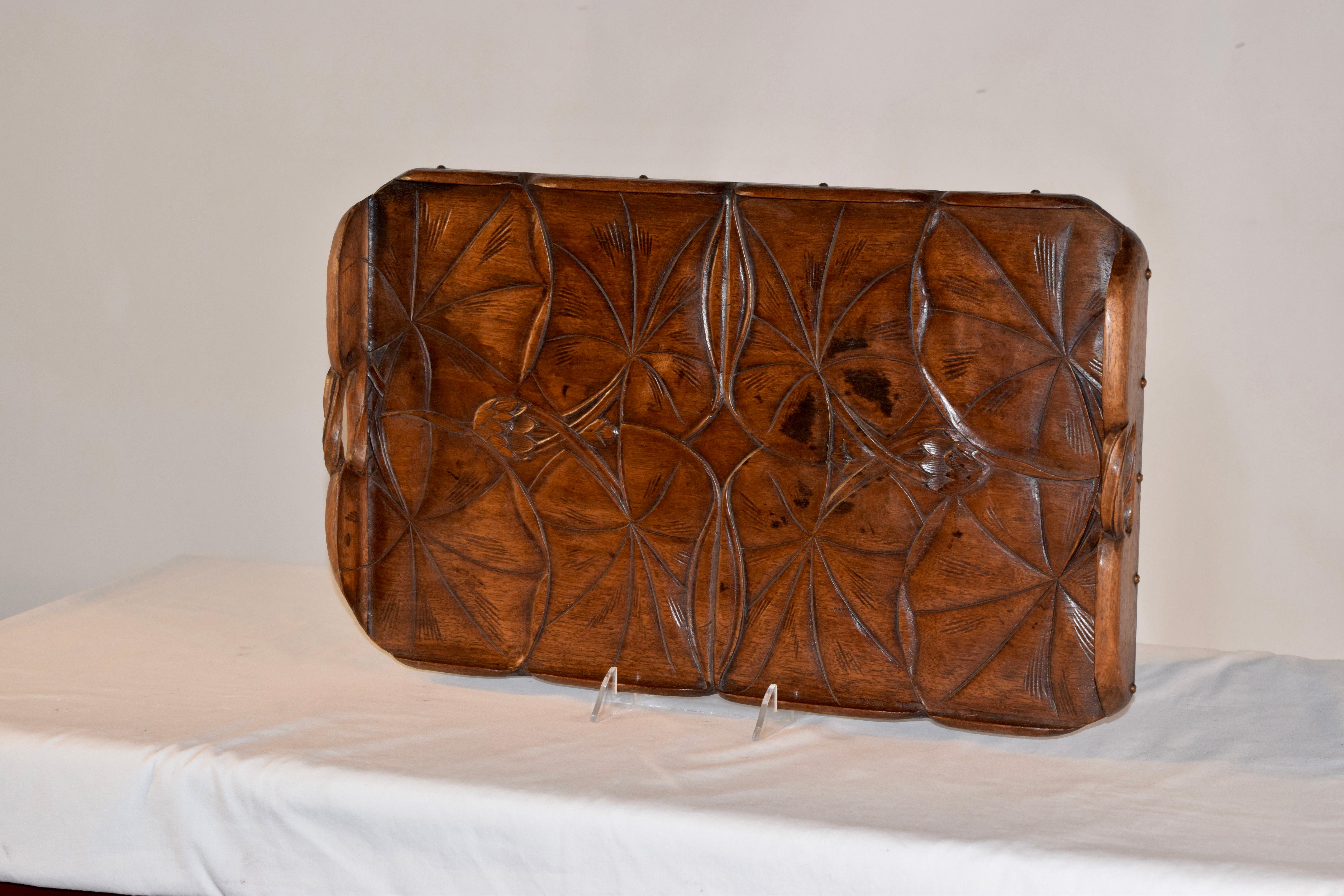 19th century hand carved tray with lily pads, surrounded by a hand carved gallery, fastened with brass screws and wonderfully shaped handles on the sides. Signed ADStevens on back.