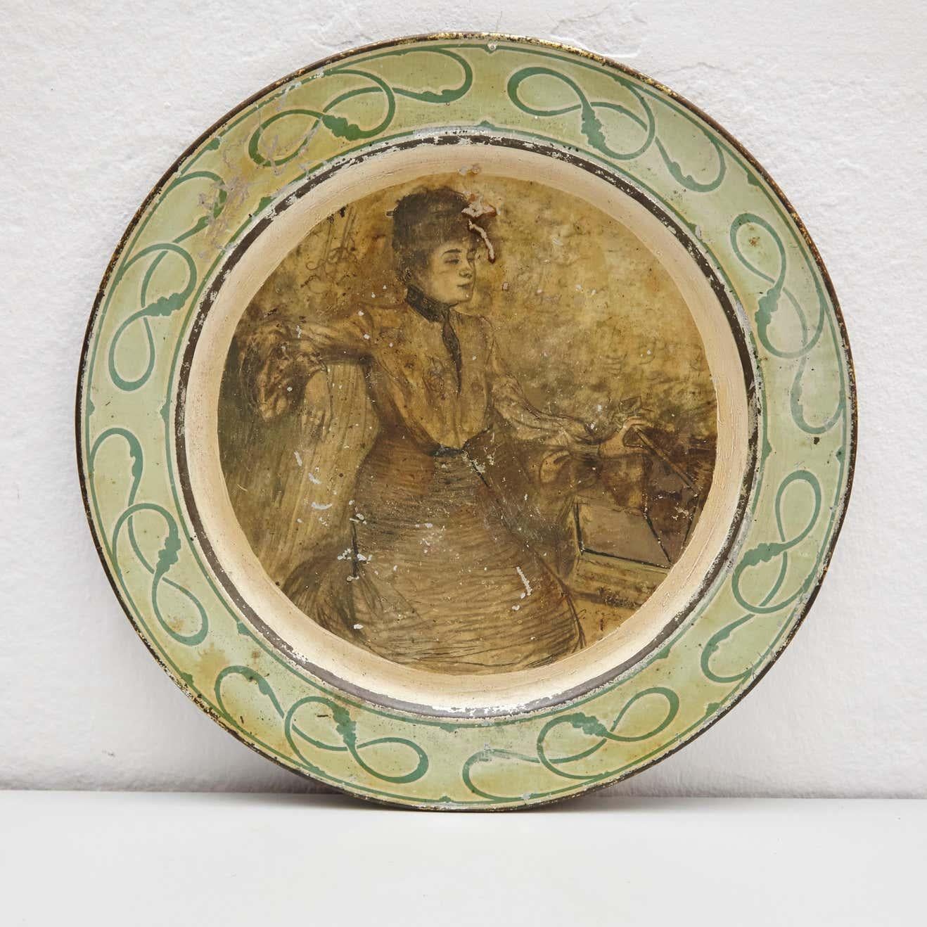 19th century metal plate, Art Nouveau style.
By unknown manufacturer, Spain.
In original condition, with minor wear consistent of age and use, preserving a beautiful patina.

Materials:
Metal

Dimensions:
ø 38 cm x 2 cm.