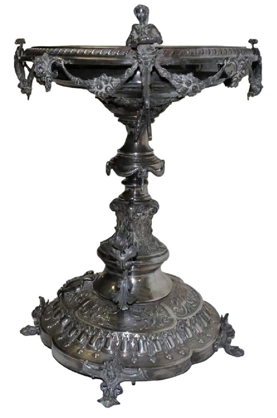 This large and monumental 19th century English centerpiece is bronze covered in silver. The hand done details are finely crafted for an elegant and fabulous look.