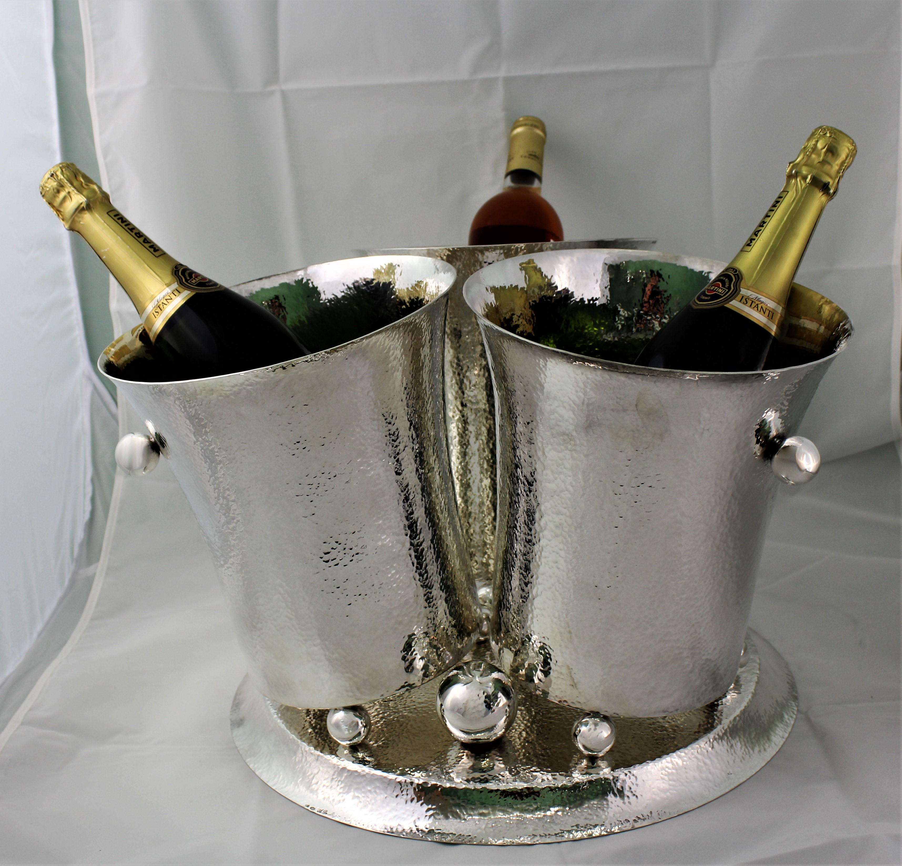 Wonderful Art Deco design hammered silver wine cooler. 

3 design hammered wine coolers with spheric handles laying on a circular hammered base. 

Realized between 1934 and 1944 by the silversmith Aldo De Mori from Bologna, Italy

Unique and