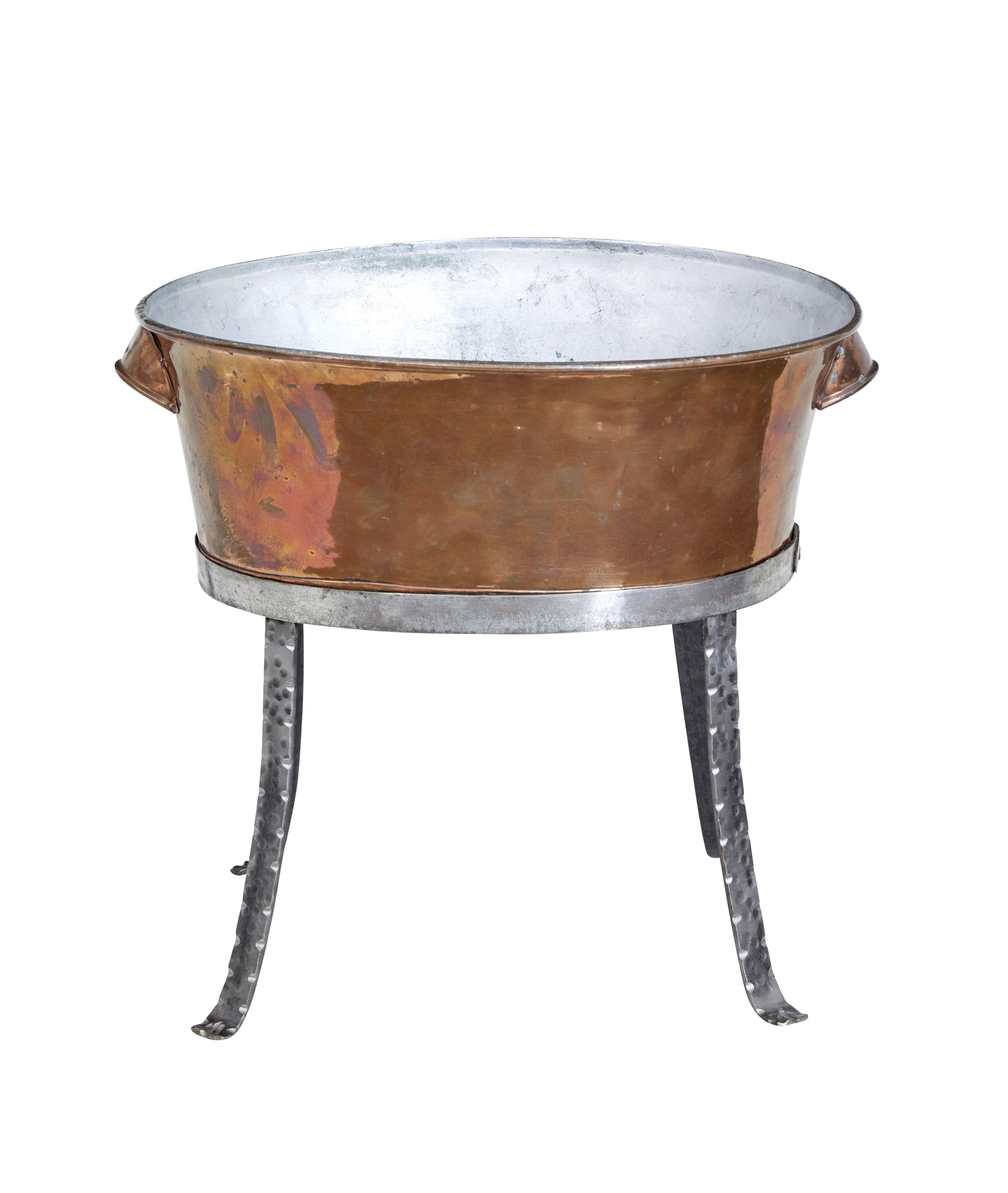 19th century arts and crafts copper bowl on stand circa 1890.

Copper pail on later hand made steel stand.  Ideal for use as a fireside kindling or log bin.

Minor expected surface marks from use, good colour and patina.