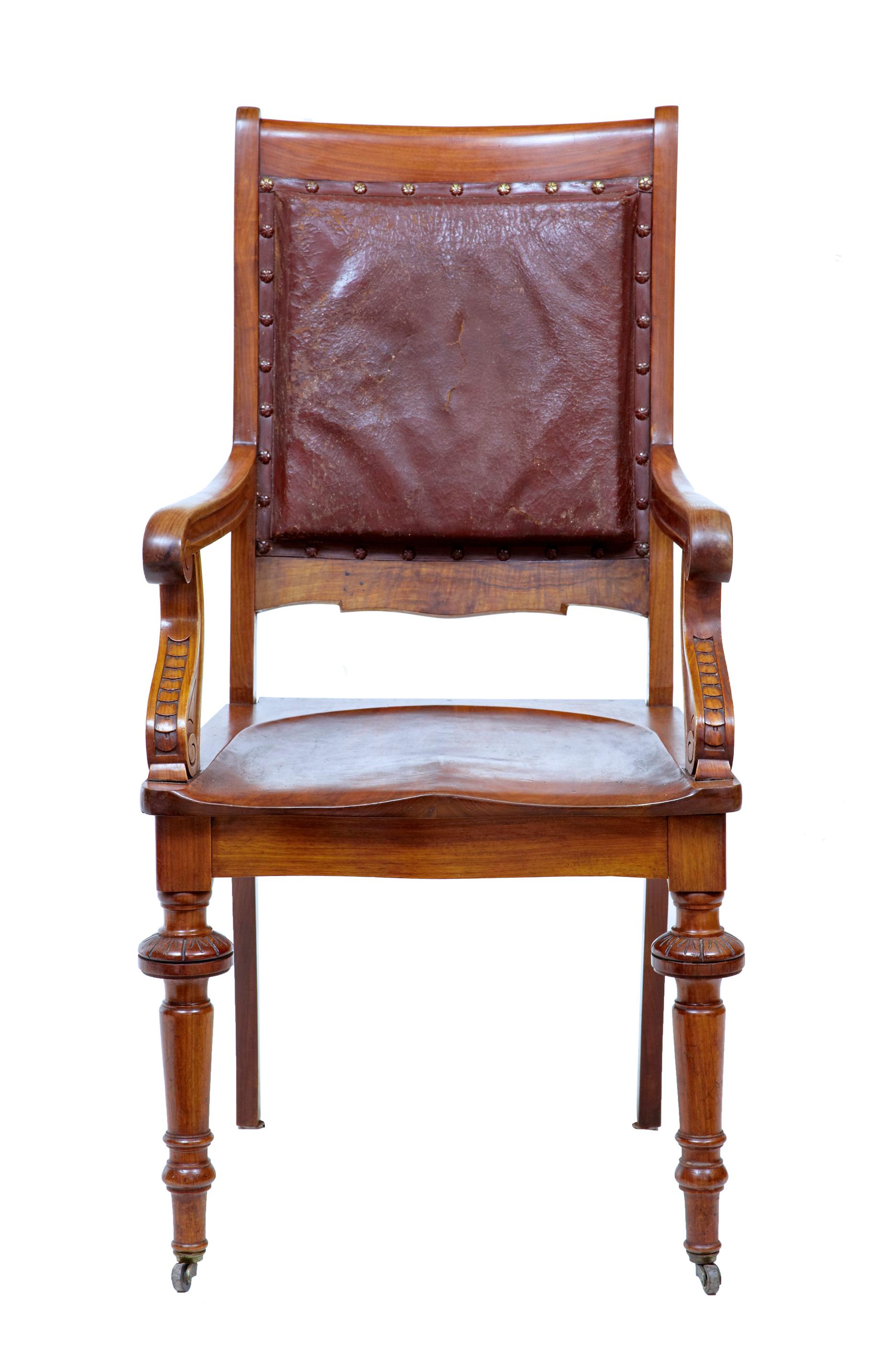 19th century Arts & Crafts mahogany desk chair circa 1890.

Good quality mahogany arts and crafts office chair. Leather backrest, with carved arms and a shaped solid seat. Original leather with stud work. Standing on front turned legs with brass