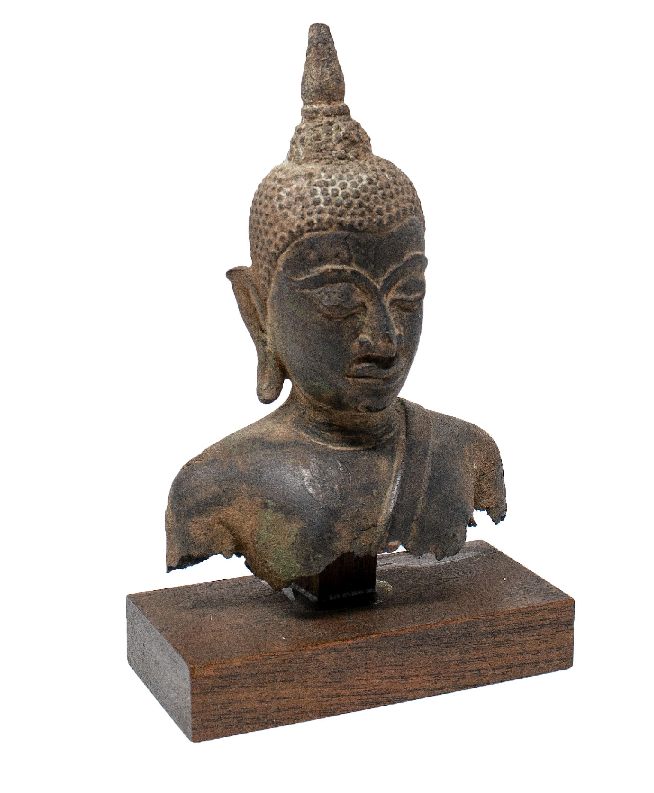 19th century Asian bronze Buddha torso on a wooden pedestal.