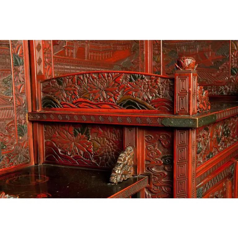 Incredible example of Asian lacquer carving. Standing over seven feet tall, this monumental display shelf was produced in Japan at the end of the Edo period, late 19th century. It features remarkable, detailed carving rivaling anything produced in