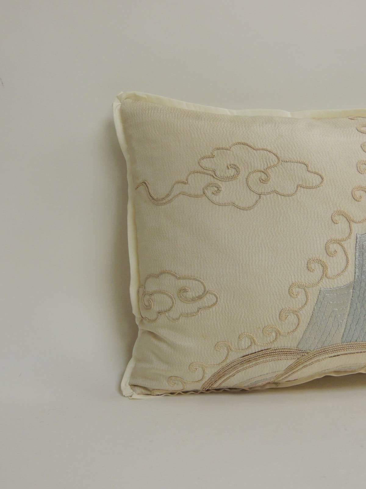 19th century Asian embroidered deco silk dragon embroidered on bolster decorative pillow. Decorative pillow embellished with an antique silver metallic trim. A.T.G. custom flat trim and ecru silk backing. Accent bolster pillow hand-crafted and