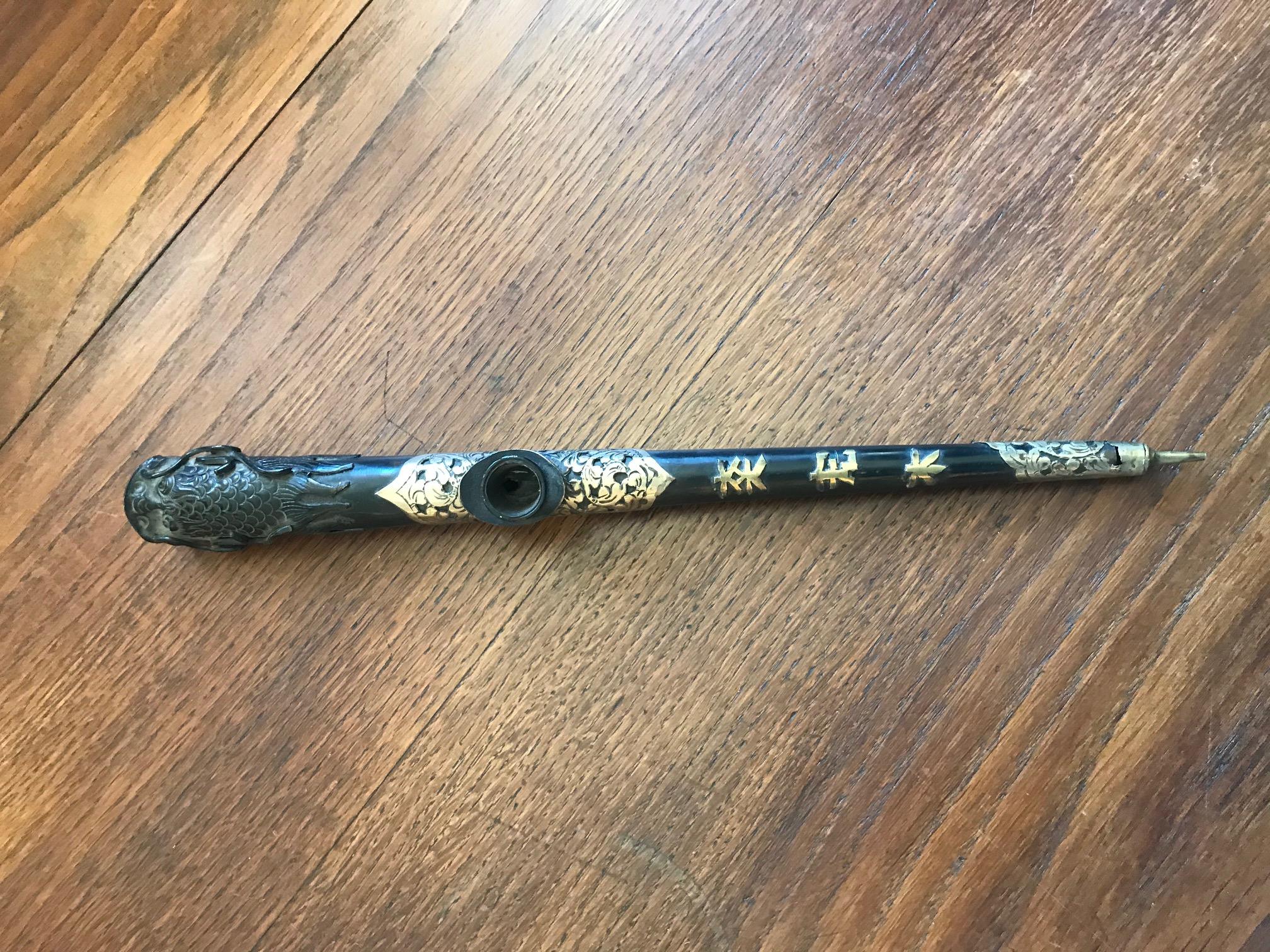 Very nice Asian Napoleon III period blackened iron wood and gilded brass opium pipe.
Dragon head on the top. Asian scripts on the wood.
Very nice quality and condition.