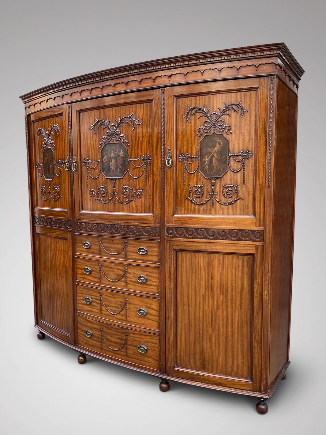 We are delighted to offer for sale this attractive 19th century Sheraton style mahogany bow fronted compactum wardrobe. The detachable decorated cornice above a central cupboard fitted with sliding trays enclosed by a bow mahogany door with