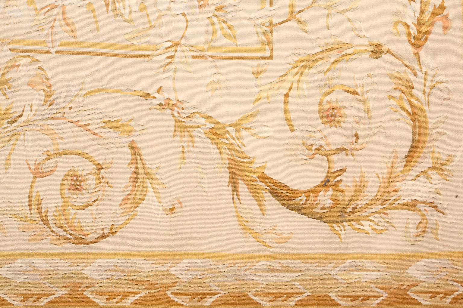 Provenance: a Park Avenue Collection

A beautiful, late 19th century French Aubusson carpet having lush, leafy rose branches on the cream field within a sand scrolling vinery border. The towns of Aubusson and Felletin, in the Creuse region of