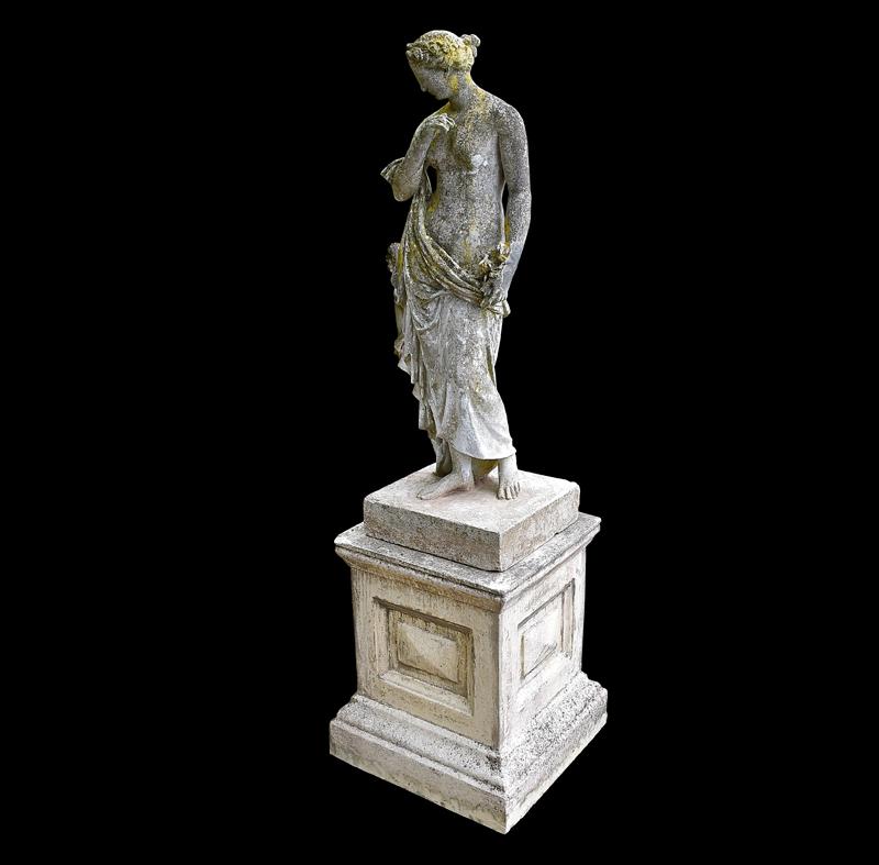 This classical figure was made by Austin and Seeley out of composition stone. Austin and Seeley are renown for their superb quality, so much so that Queen Victoria was a patron. The detail created in the clothing, hair and feet of this statue shows