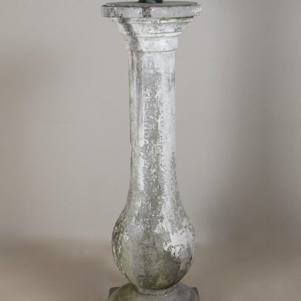 An early 19th century pot bellied, marble sundial pedestal, later painted, with a rare stamped bronze sundial plate by Austin and Seeley, dated 1861.

Felix Austin started producing artificial stone ornaments in 1828, going into partnership with