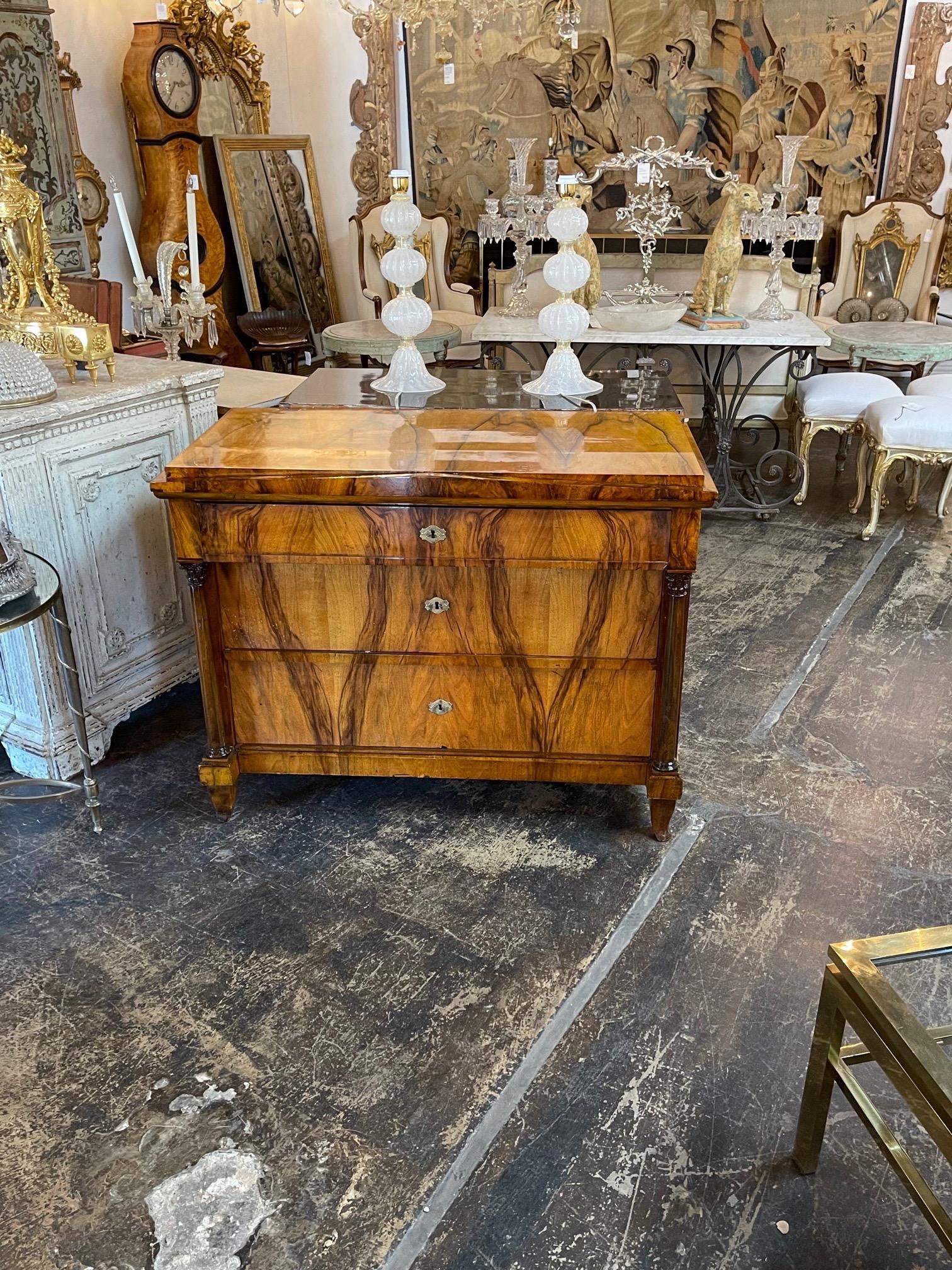 Outstanding 19th century Austrian Biedermeier black walnut commode. Very pretty wood grain and amazing finish. Three drawers for storage as well. So elegant!!