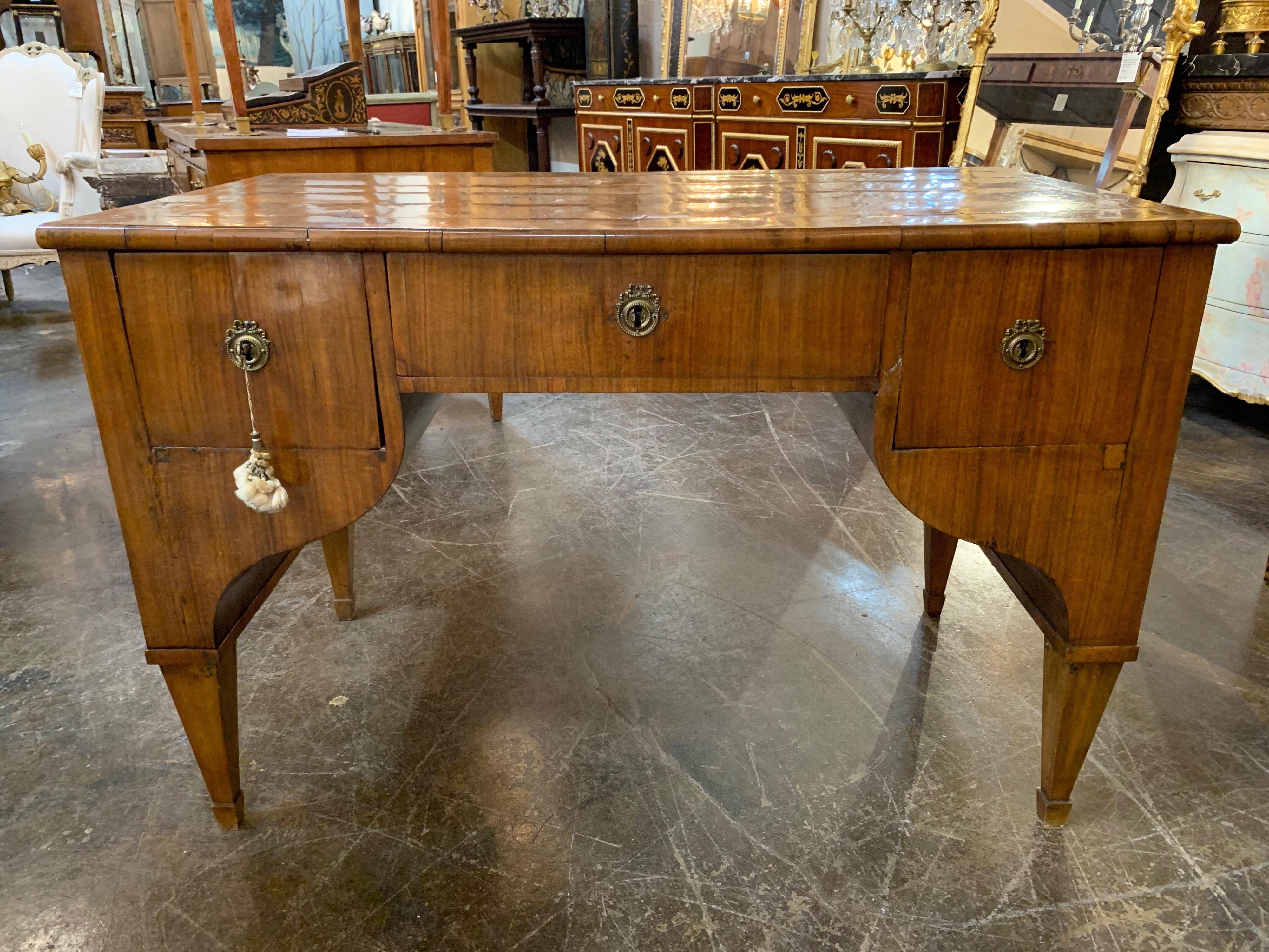 Very handsome mahogany writing desk in the Classic Biedermeier style. Beautiful wood grain and nice storage as well. Perfect for a study or library.