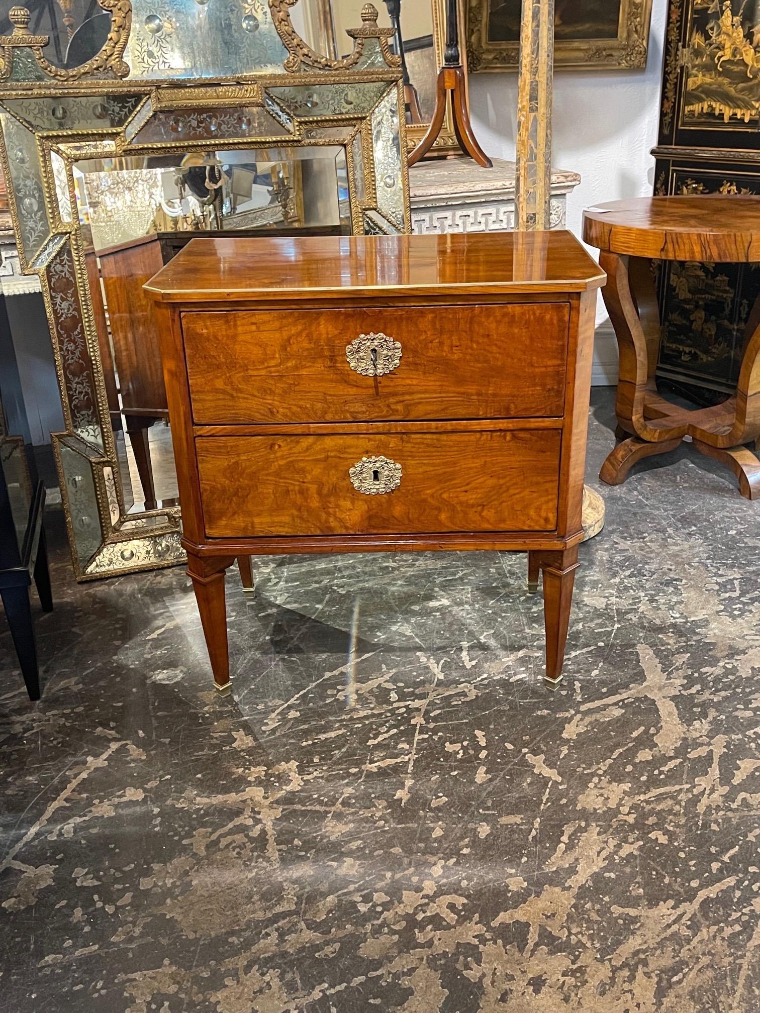 Exceptional early 19th century Austrian Biedermeier walnut and brass side table. Beautiful polished finish and very nice brass details. A classic and stylish piece that adds a real touch of class!