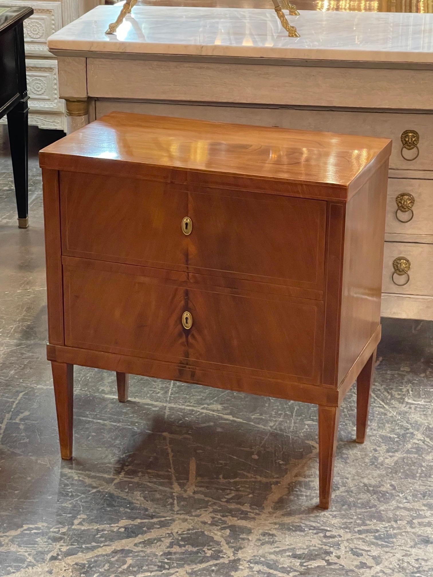 Handsome 19th century Austrian Biedermeier Walnut bedside table. Beautiful polished wood and 2 drawers for storage. Creates a very stylish look!