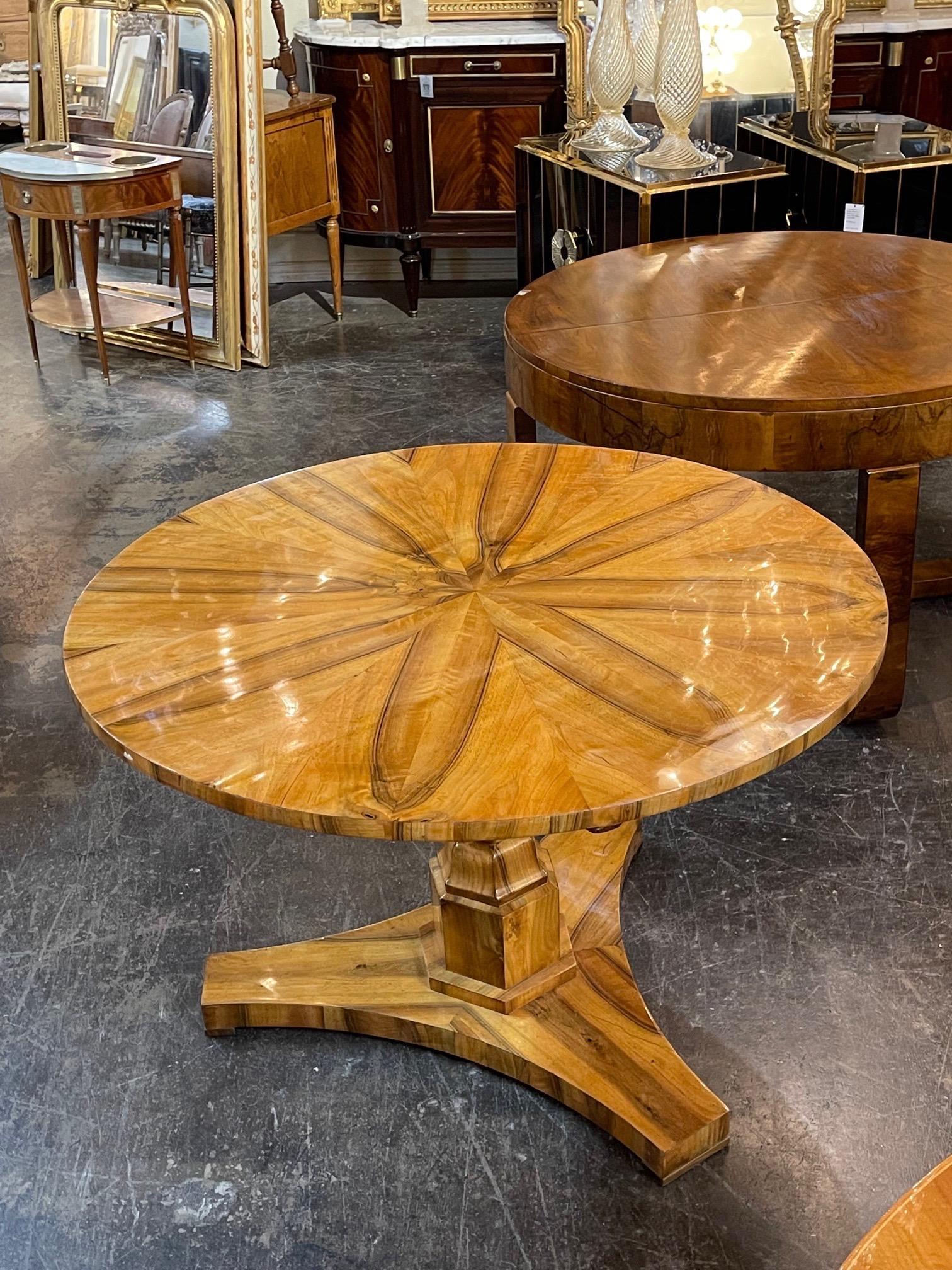 Exceptional 19th century Biedermeier walnut center table from Vienna, Austria. Superb polished finish along with an interesting design on the top. An outstanding piece!!