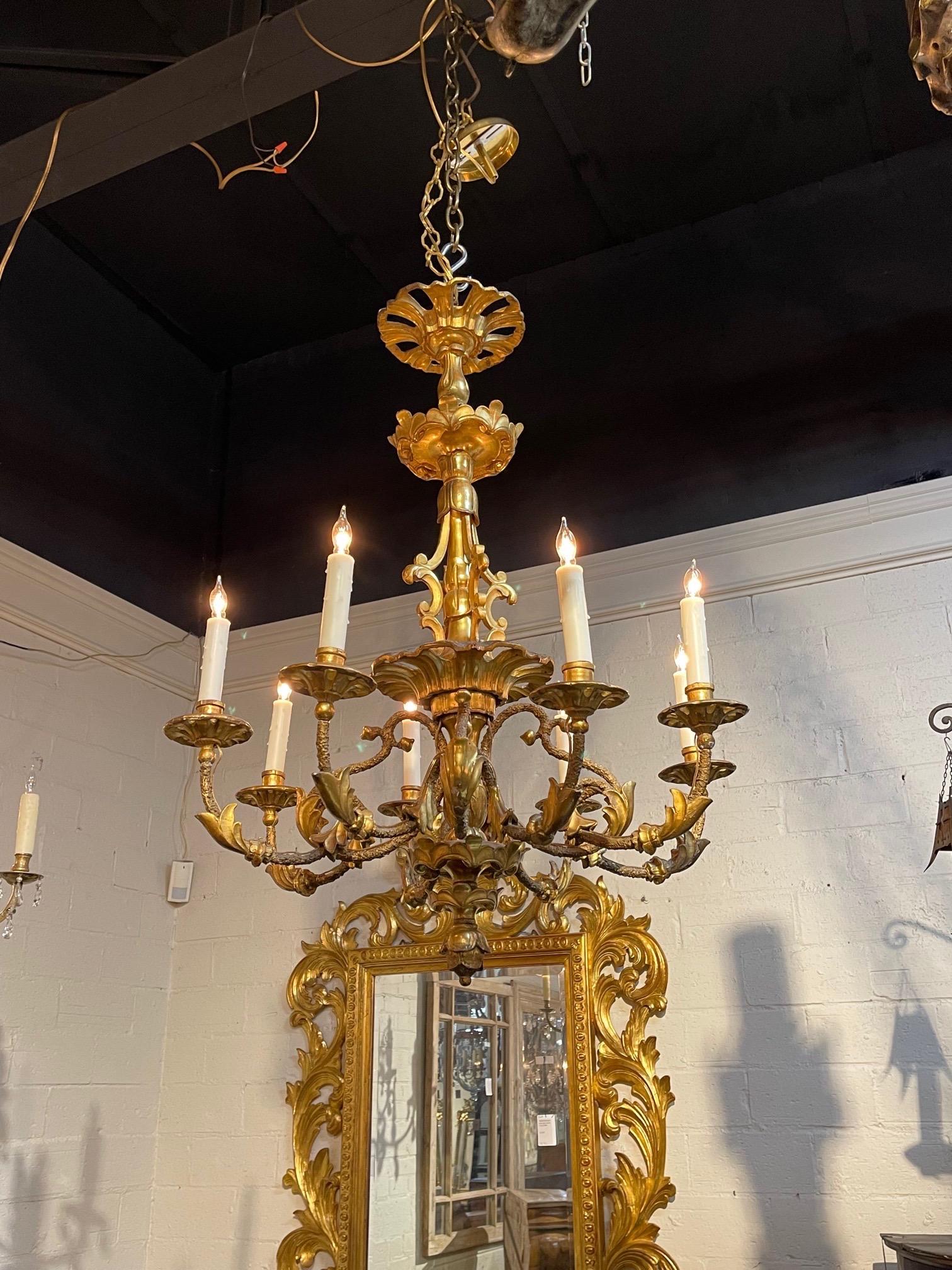 Lovely 19th century Austrian carved and giltwood 8 light chandelier. Beautiful carvings on this fixture. Creates an elegant look!!