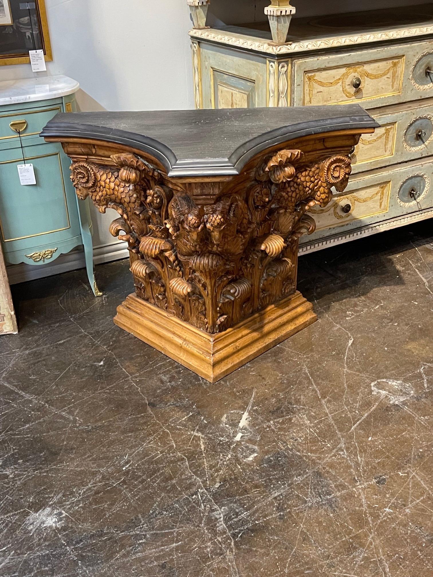 Handsome 19th century Austrian carved pine neo-classical console with slate top. Exceptional intricate carvings on this piece including Ram's heads. Stunning!.