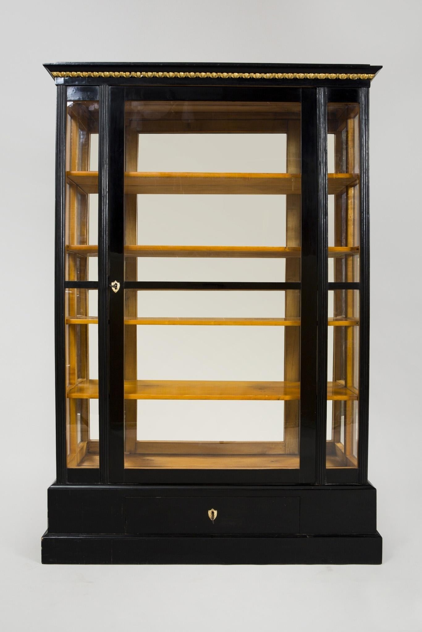 19th century Empire display cabinet from Austria
Completely restored, surface made by shellac polish.
   
