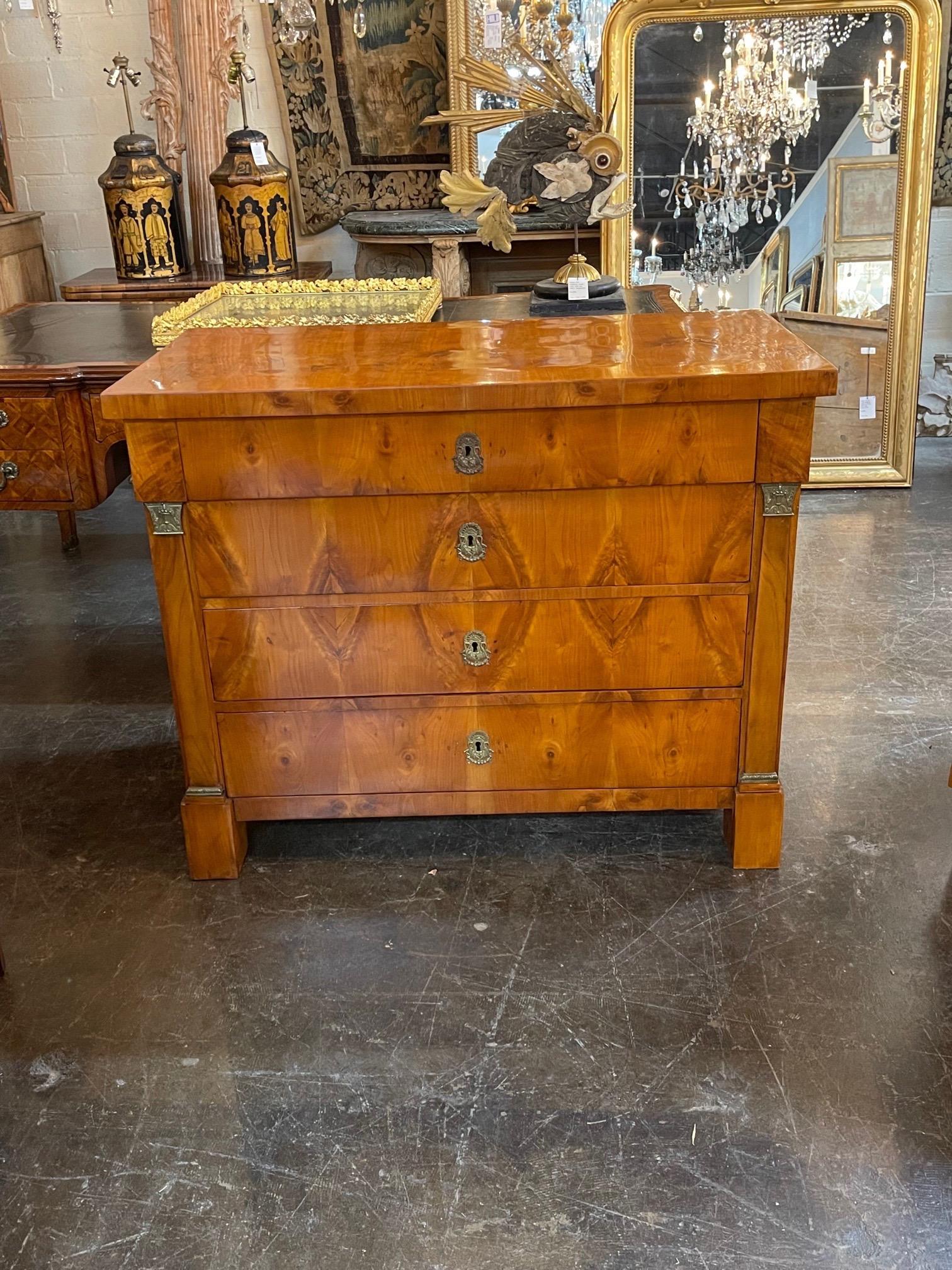 Very fine 19th century Austrian Empire walnut commode. Exceptional wood finish and superb quality. A truly elegant piece that is sure to impress!.