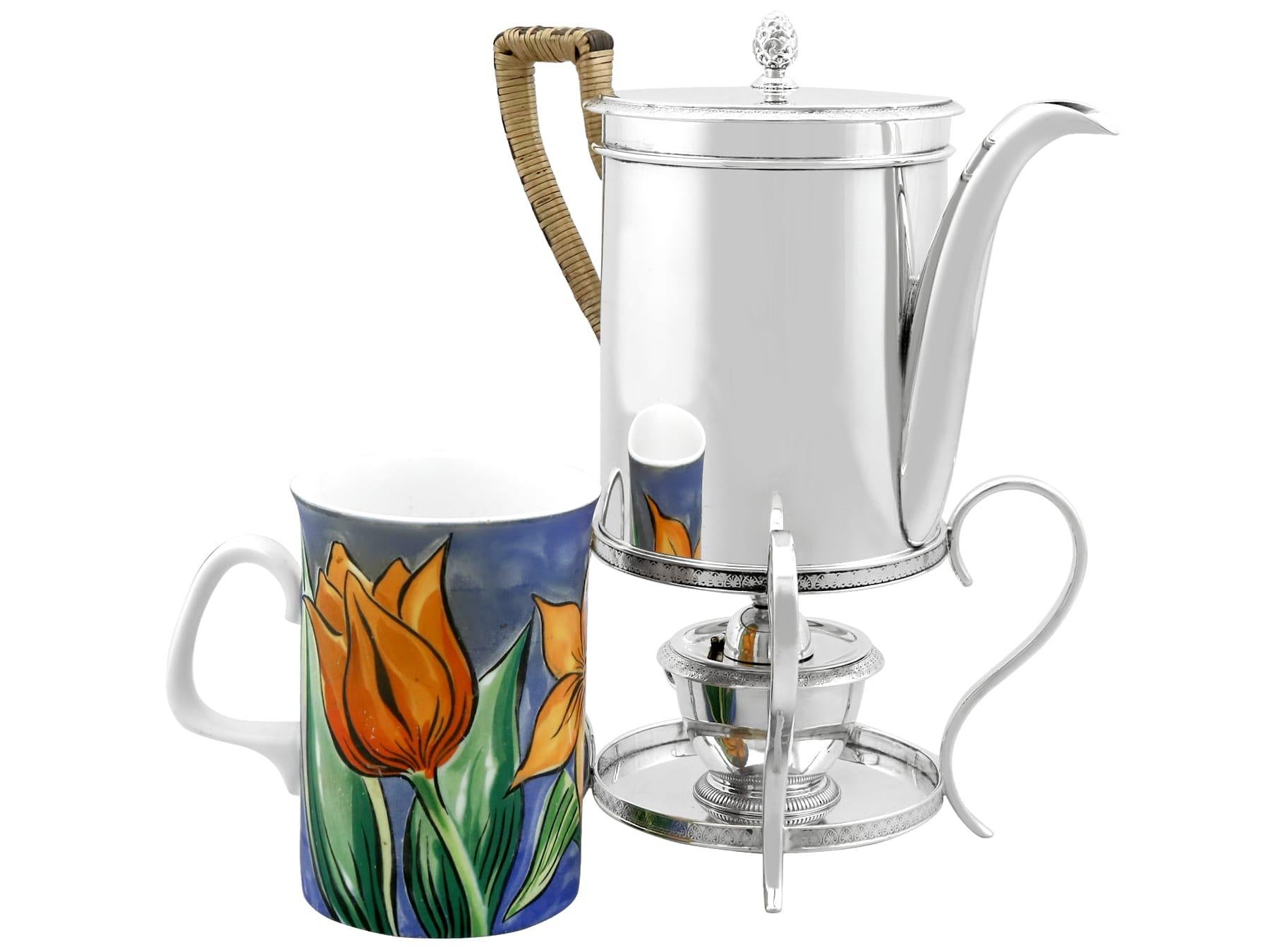An exceptional, fine and impressive antique Austrian silver coffee pot with spirit burner; an addition to our Georgian silver teaware collection

This exceptional antique Austrian silver coffee pot has a plain cylindrical form.

The coffee pot body