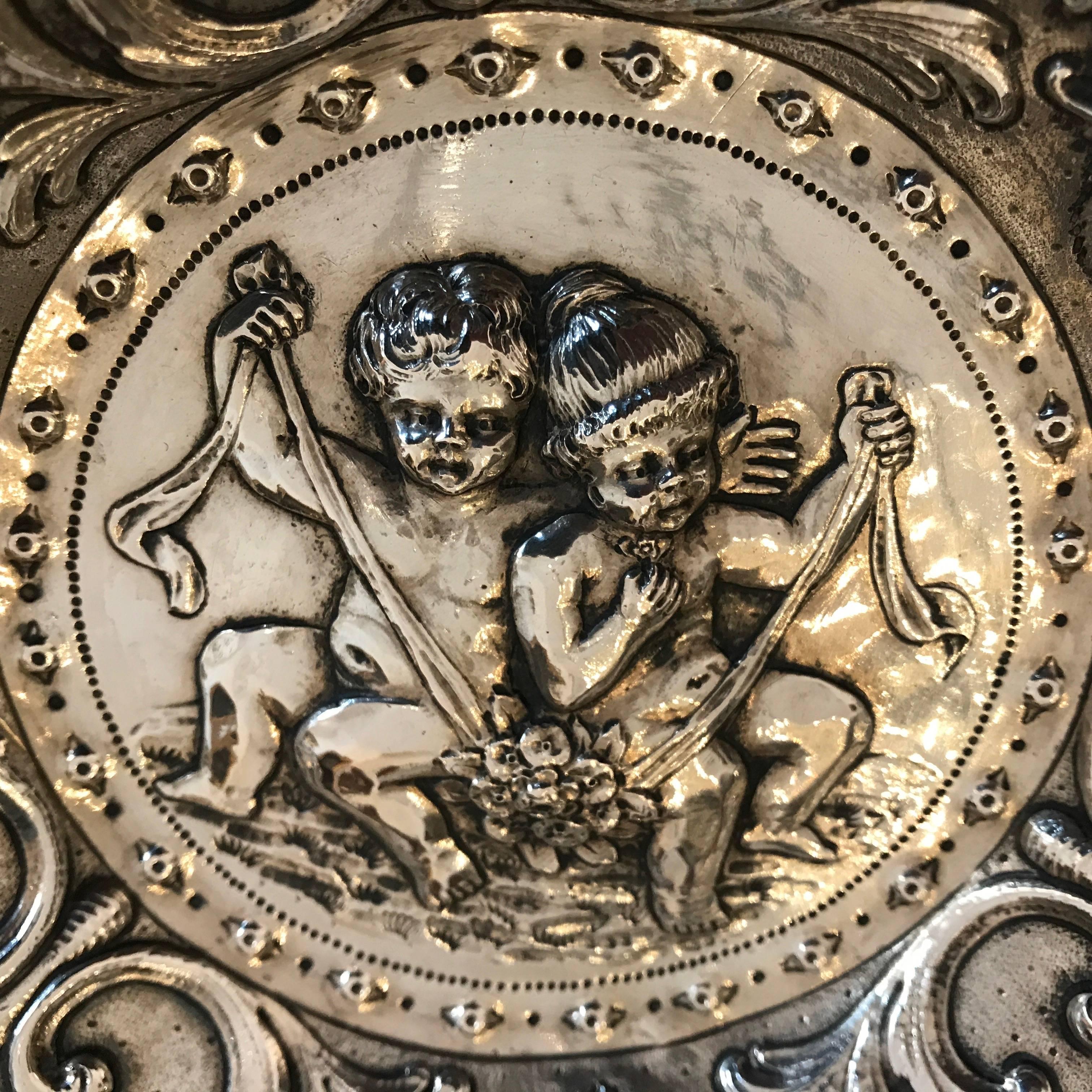 Embossed 19th Century European Repoussé Silver Dish with Children Grotesque Mask FIgures