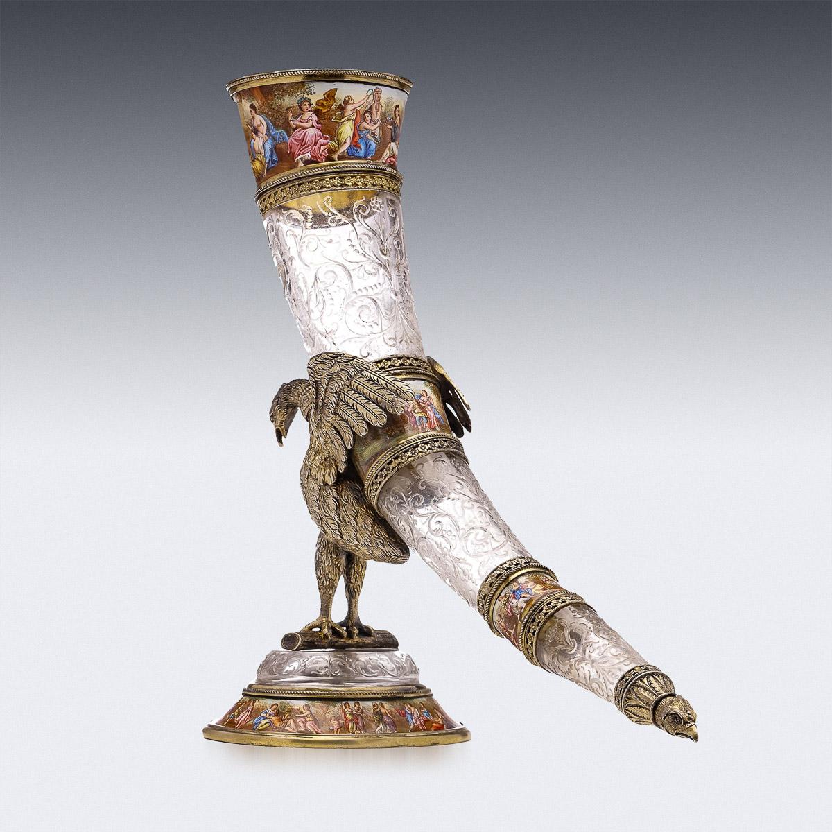 Antique 19th Century Austrian exceptionally rare solid silver gilt, enamel and rock crystal drinking horn, by Hermann Ratzersdorfer, Vienna, circa 1880s. The drinking horn is made of rock crystal is supported on the back of a spread-winged pelican,