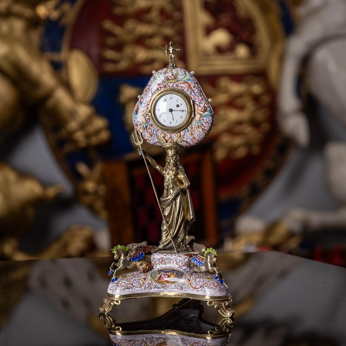 19th century Austrian silver gilt & hand painted enamel clock, heart shaped, mounted with fresh water pearls and a figural finial, elevated by a figure of Poseidon on a triangular base. The corners set with three Hippocampus (mythical sea horses),