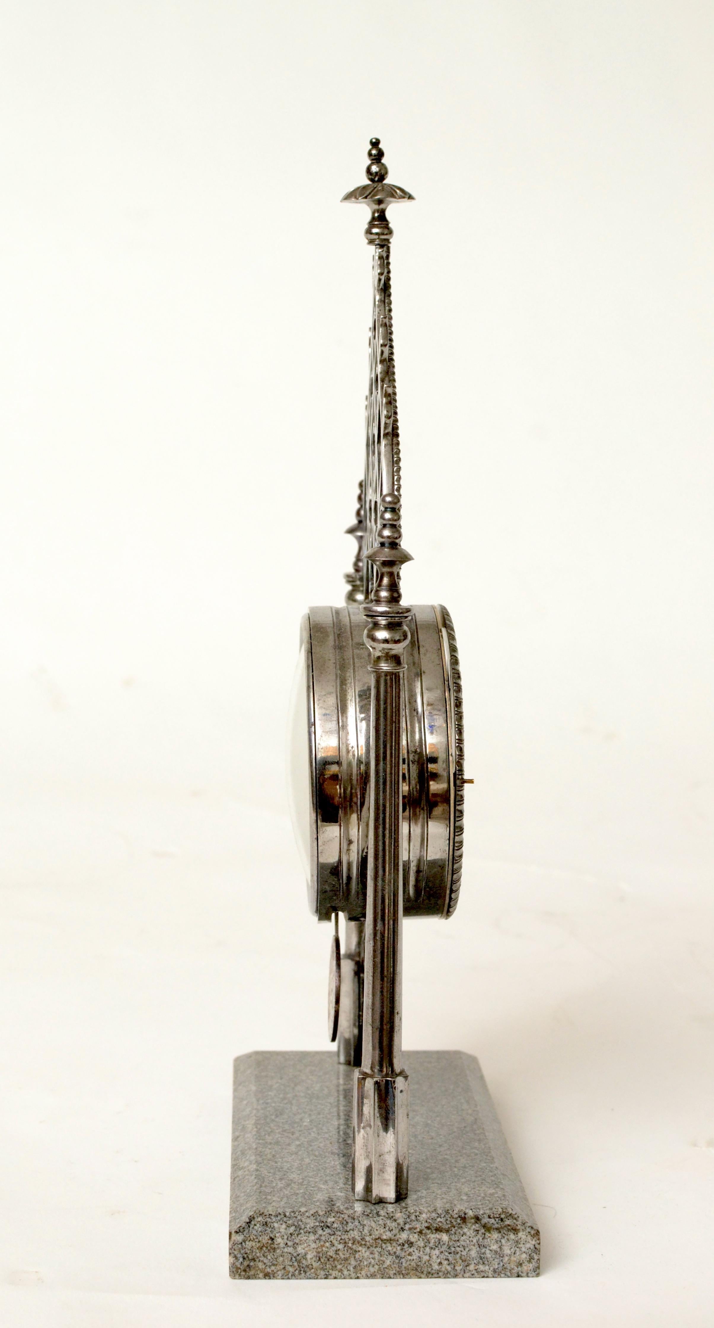 An unusual Austrian polished steel and cut Schardinger Granite table clock, neo Gothic. Made around. 1840. The case and base in very good condition and with the original pendulum. Fitted with original clockwork but presently not working. 
A fine and