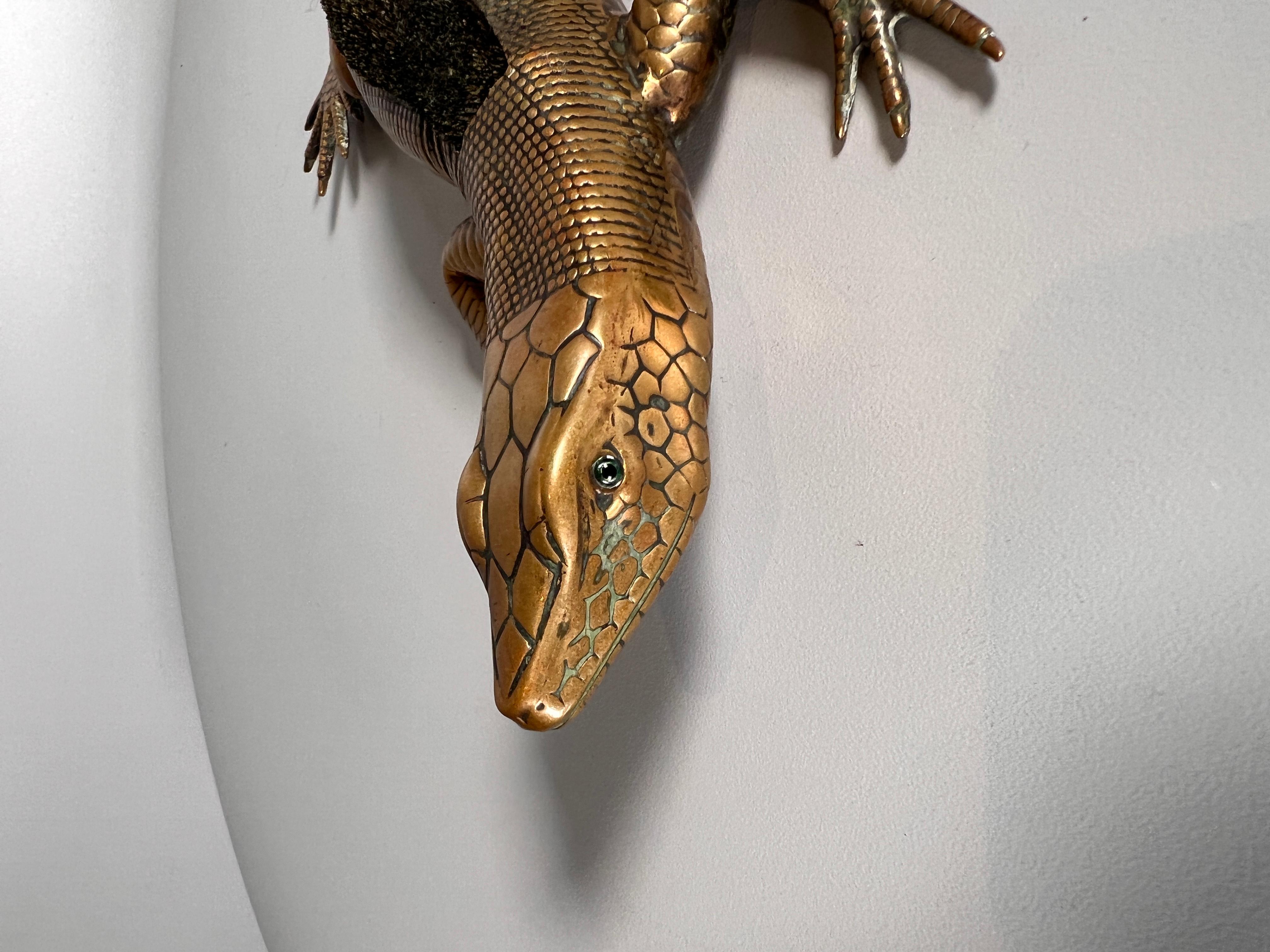 A fantastic and very large pen wipe in the form of a lizard, beautifully cast in bronze the lizard has inset glass eyes.