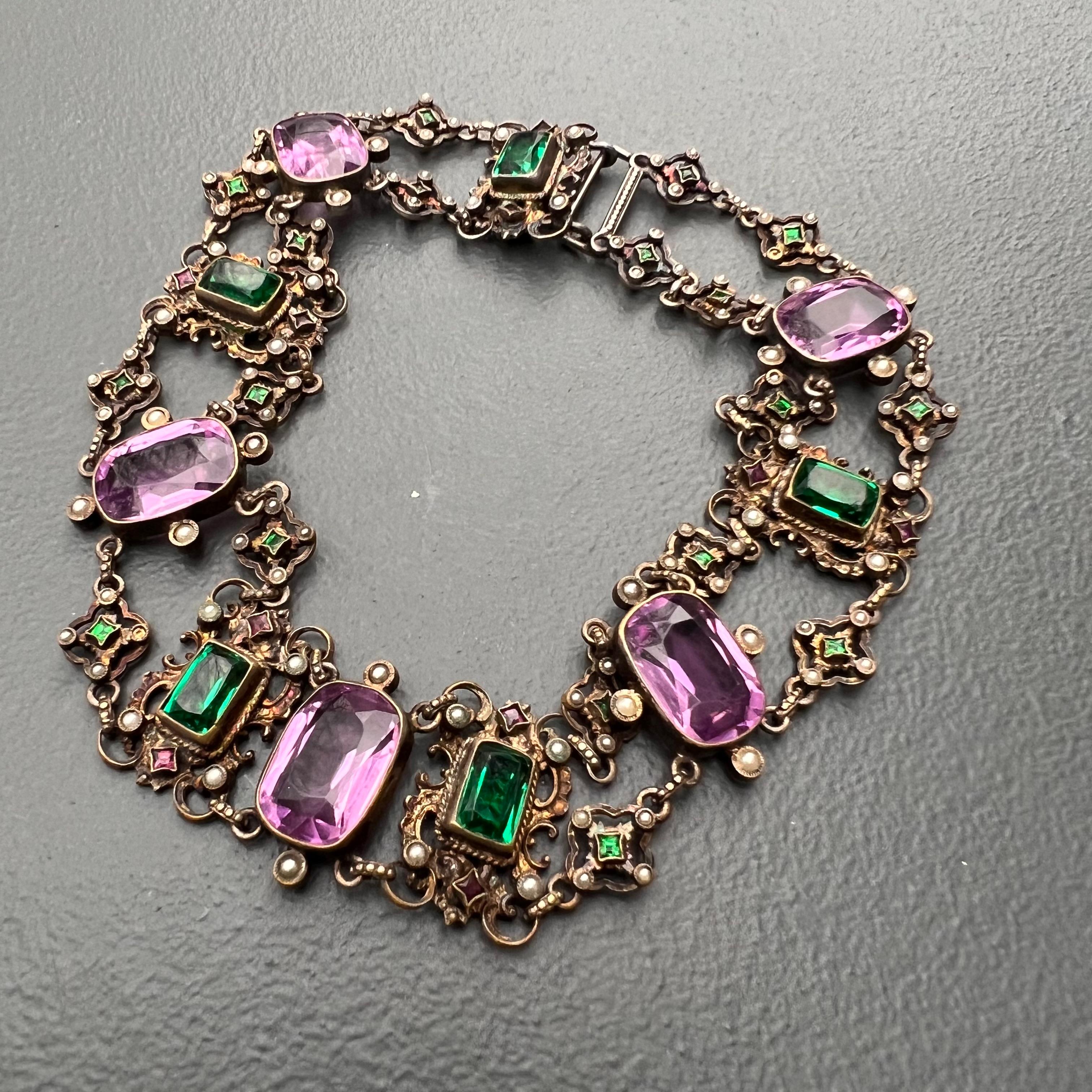 Antique 19th century Austro Hungarian gilt metal , paste /glass stones choker necklace with small faux pearls . Larger faceted amethyst glass stones are set on an open-back setting .

Necklace is for smaller neck length or add an velvet ribbon for