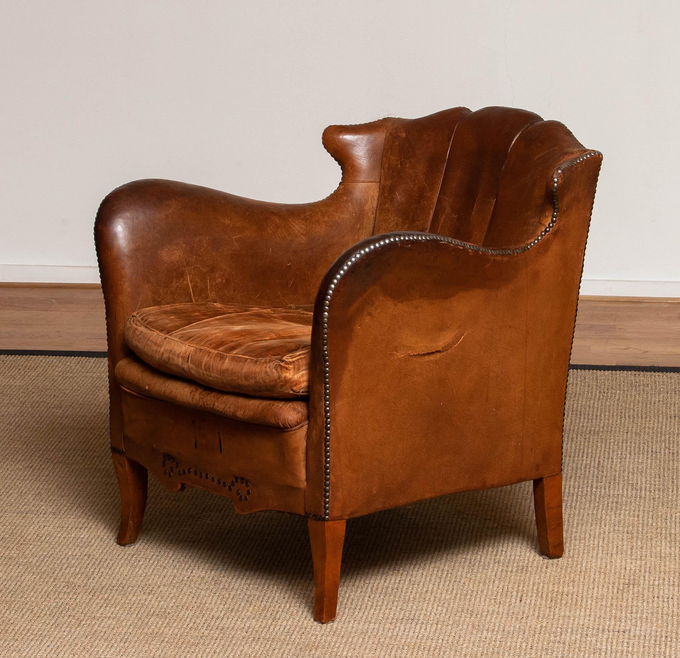 Absolutely unique and stunning authentic wing back ( more in the shape of horns ) club / lounge / cigar chair from the 19th century made in Sweden.
The great vintage / antique patina gives the chair her absolutely unique and beautiful patina and