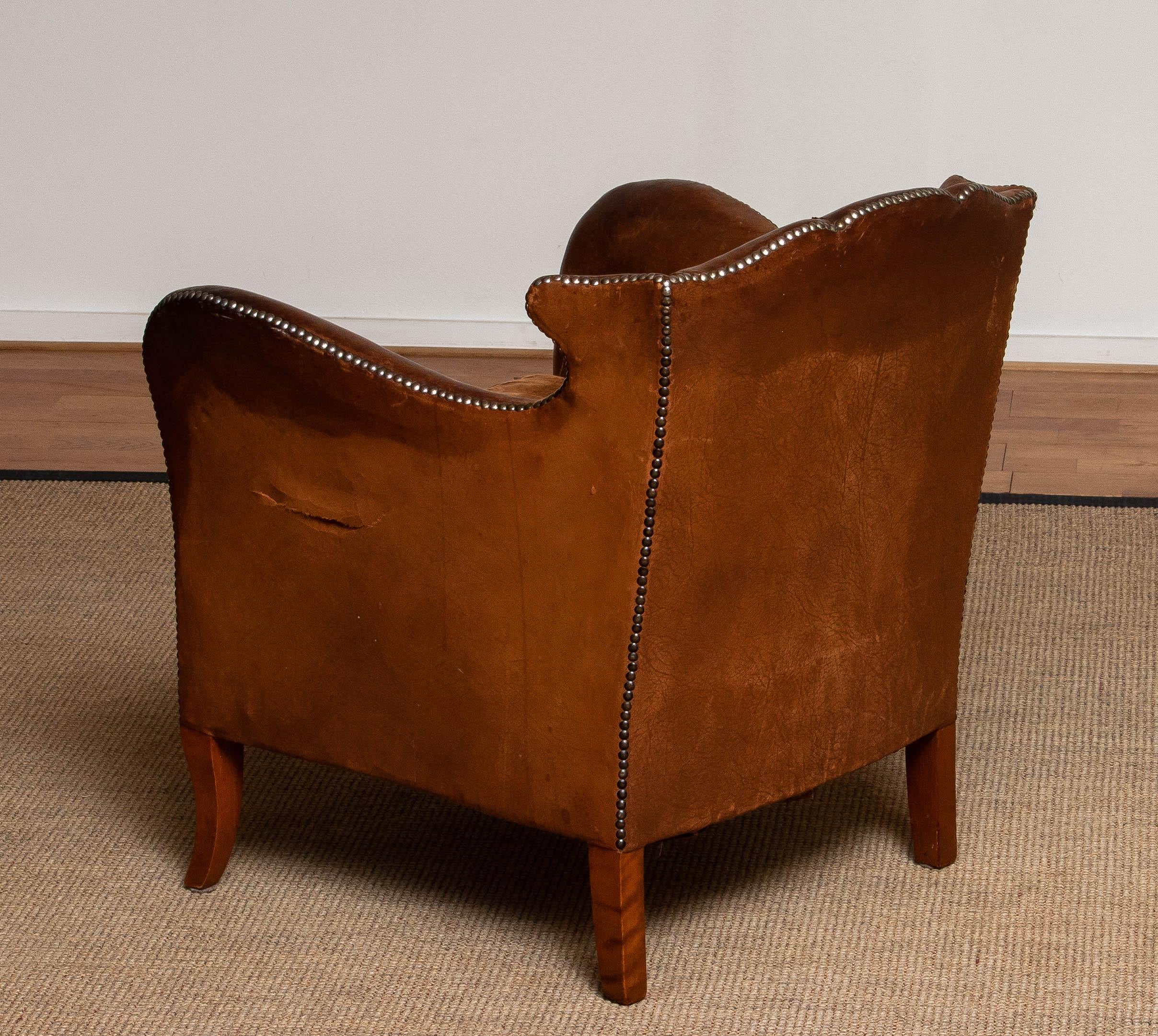 Late 19th Century 19th Century Swedish Tan / Brown Nailed Leather Wing Back Club / Cigar Chair