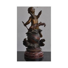 Bronce del siglo XIX "Bebé cabalgando sobre la tierra" de Léon Pilet