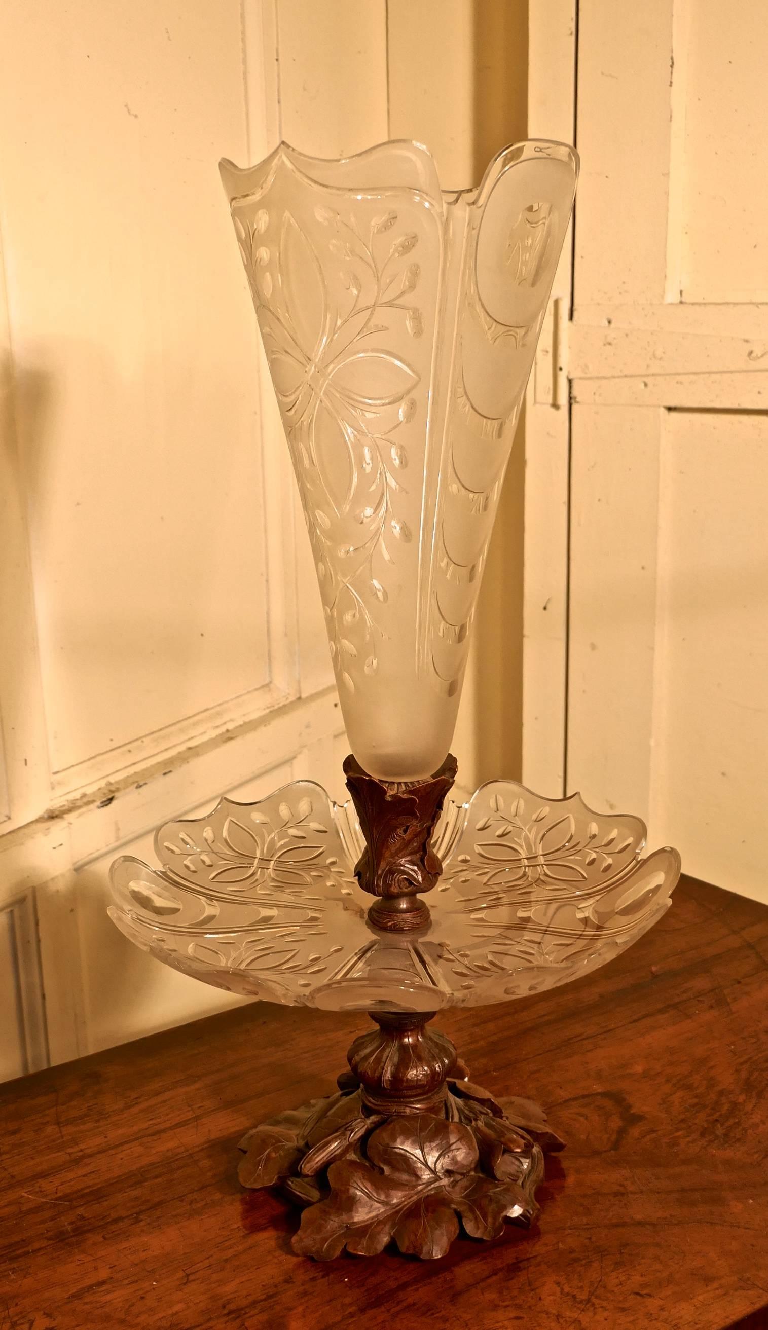 19th century Baccarat crystal epergne, Black Forest centrepiece

A superb and very unusual combination, a Black Forest pedestal carved with oak leaves, mounted with an etched crystal dish, which in turn has another Black Forest carved mount