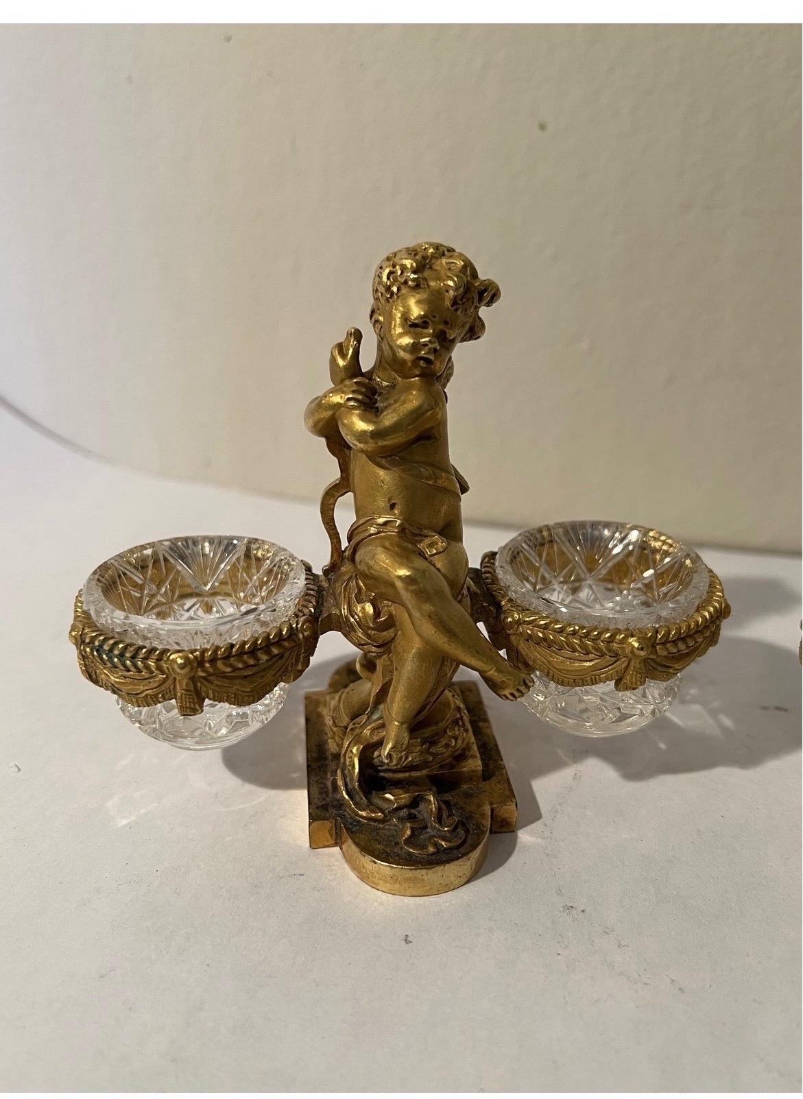 Excellent pair of gilt bronze double cherub salt cellars! Fully marked to bottom. Each with removable crystal bowls, which i will be including a 5th (incase one breaks!).