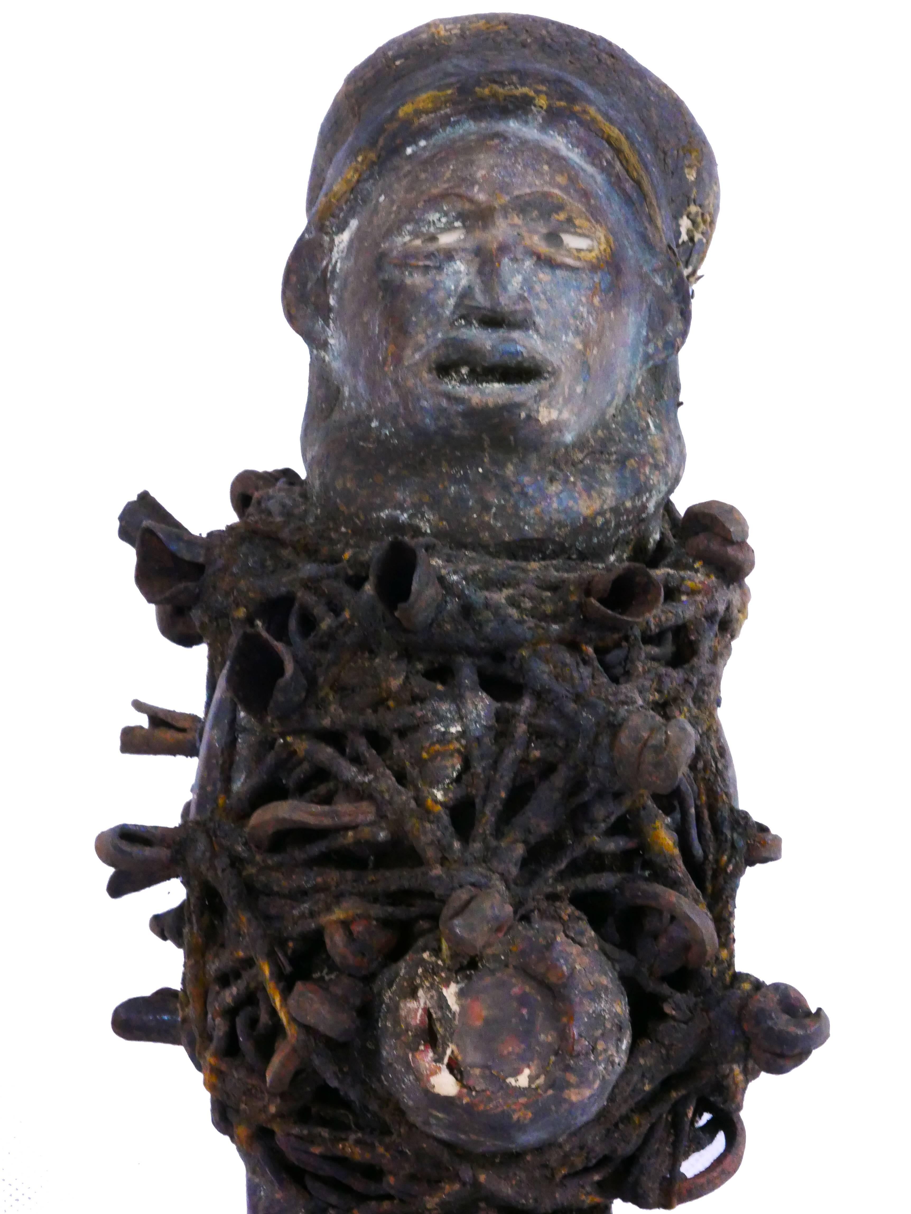 Nail Fetish 'Nkisi'
Bacongo people; Congo
Wood, pigment, fabric, metal 
Dimensions: H 10.5, W 4 inches
Approximate age: 100 years (+/- 7) old confirmed by the Museum of Arts and Science, Milan 

This African tribal artifact is a gem for