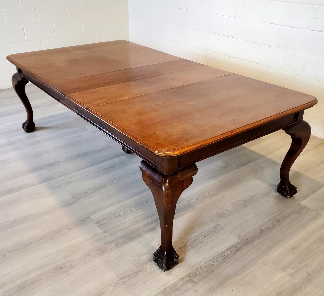 This is a 19th Century Dining table in hardwood with three extension leaves. The heavy duty ball and claw features make for a real statement of a table.  This table is something special in the size and scale of the details. 
 It is certainly not
