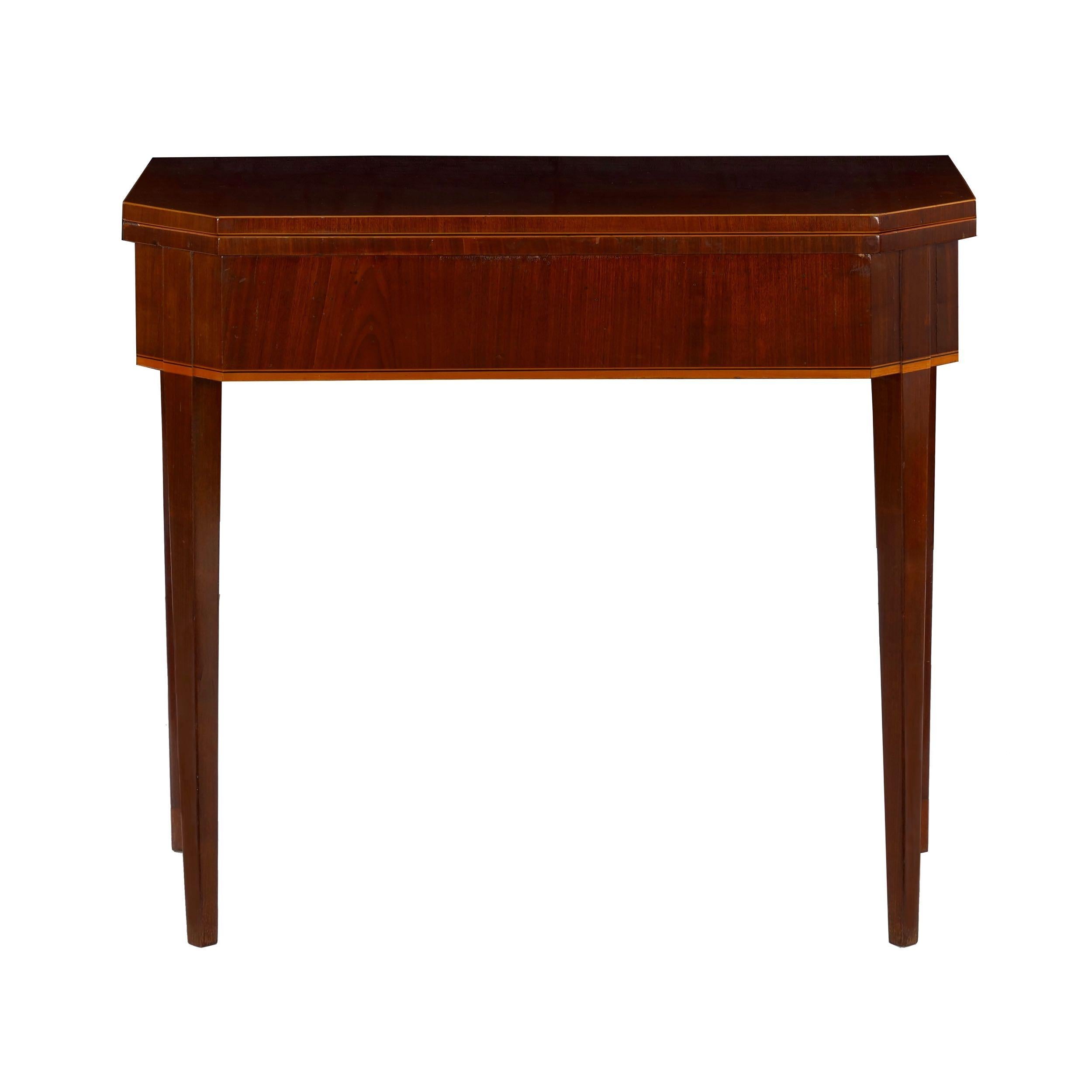An attractive games table in the neoclassical taste, likely a product of the Baltic States during the first half of the 19th century, this table exhibits the typical form for these popular and versatile tables. First presenting as a console, the