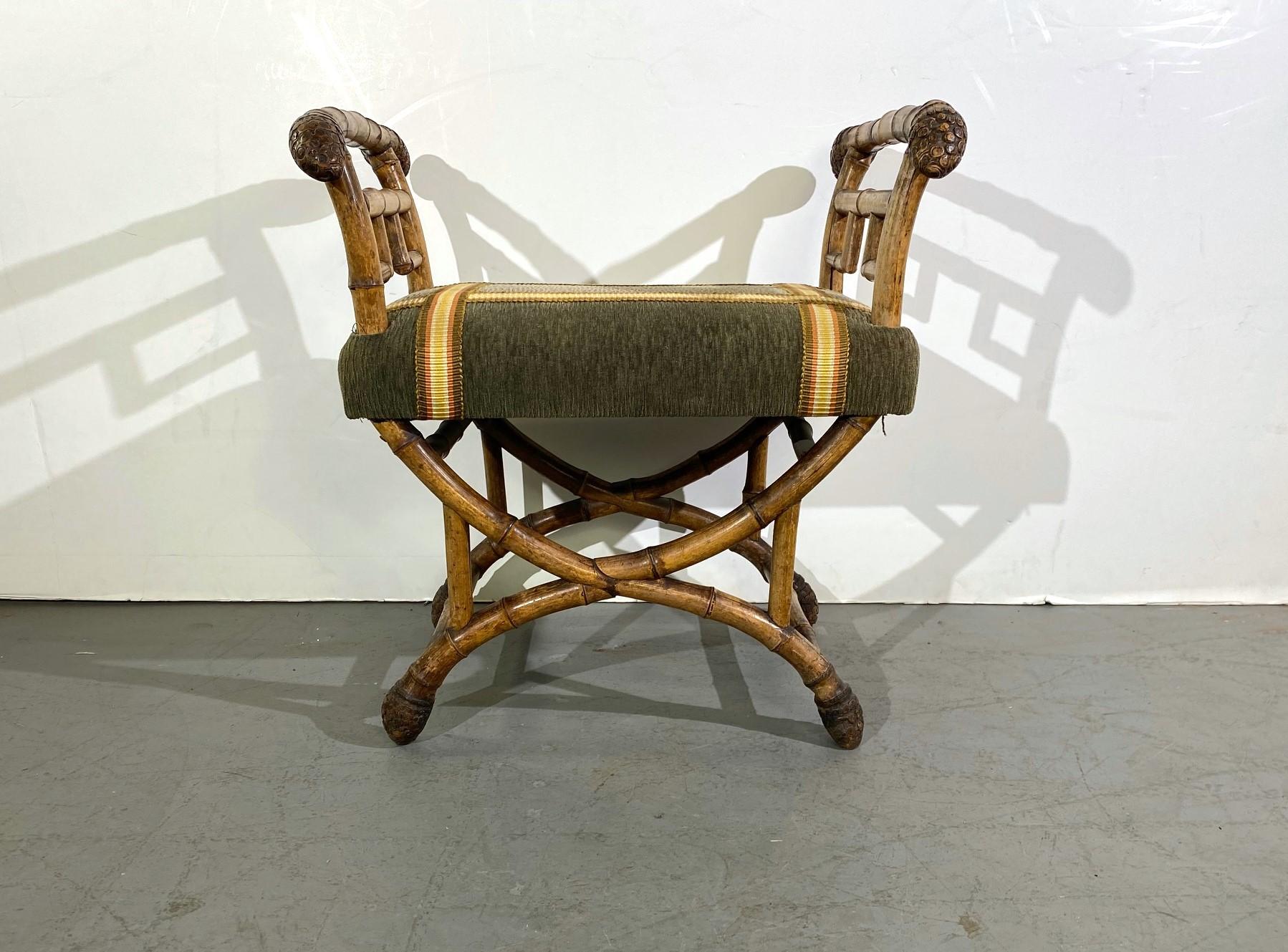 English 19th-century bamboo bench with arms on each side.