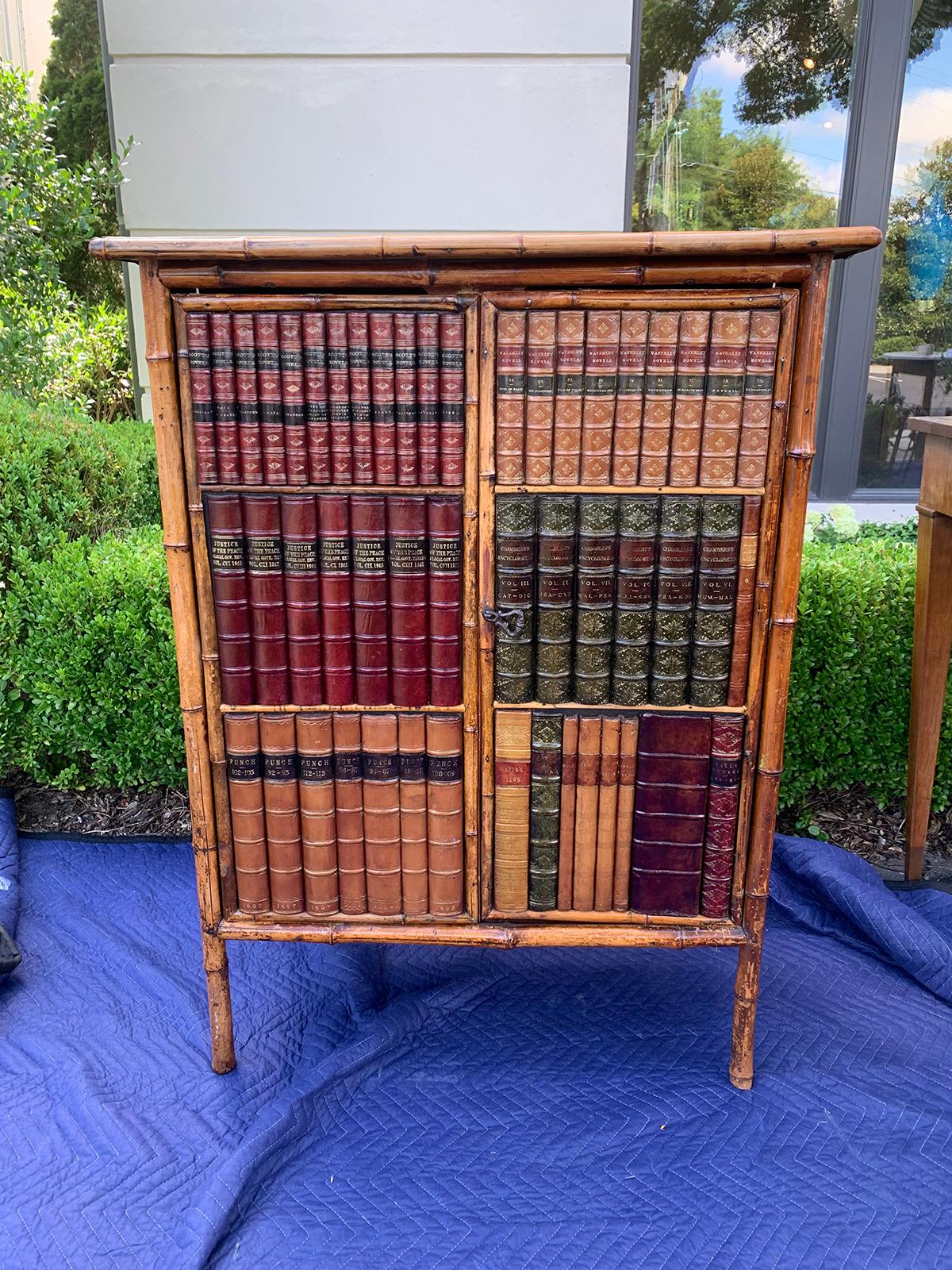 19th century bamboo cabinet with leather book spines as doors
Three interior shelves.