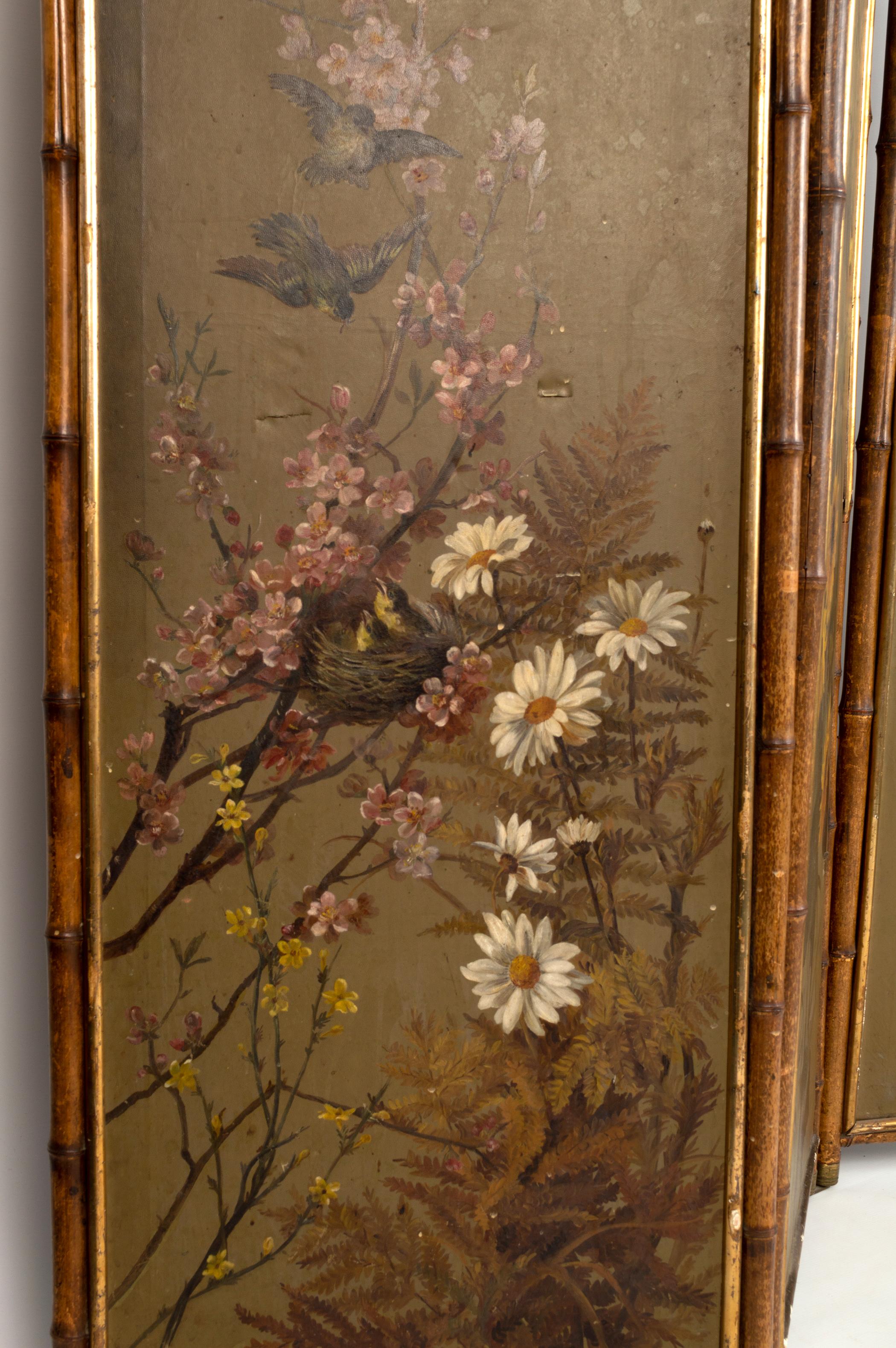 A 19th Century Anglo-Chinese three fold bamboo screen with later added botanical painted leatherette panels dating from C.1920. Finished in brass detailing with filigree fretwork tops.

A beautiful decorators piece. In good unrestored condition,