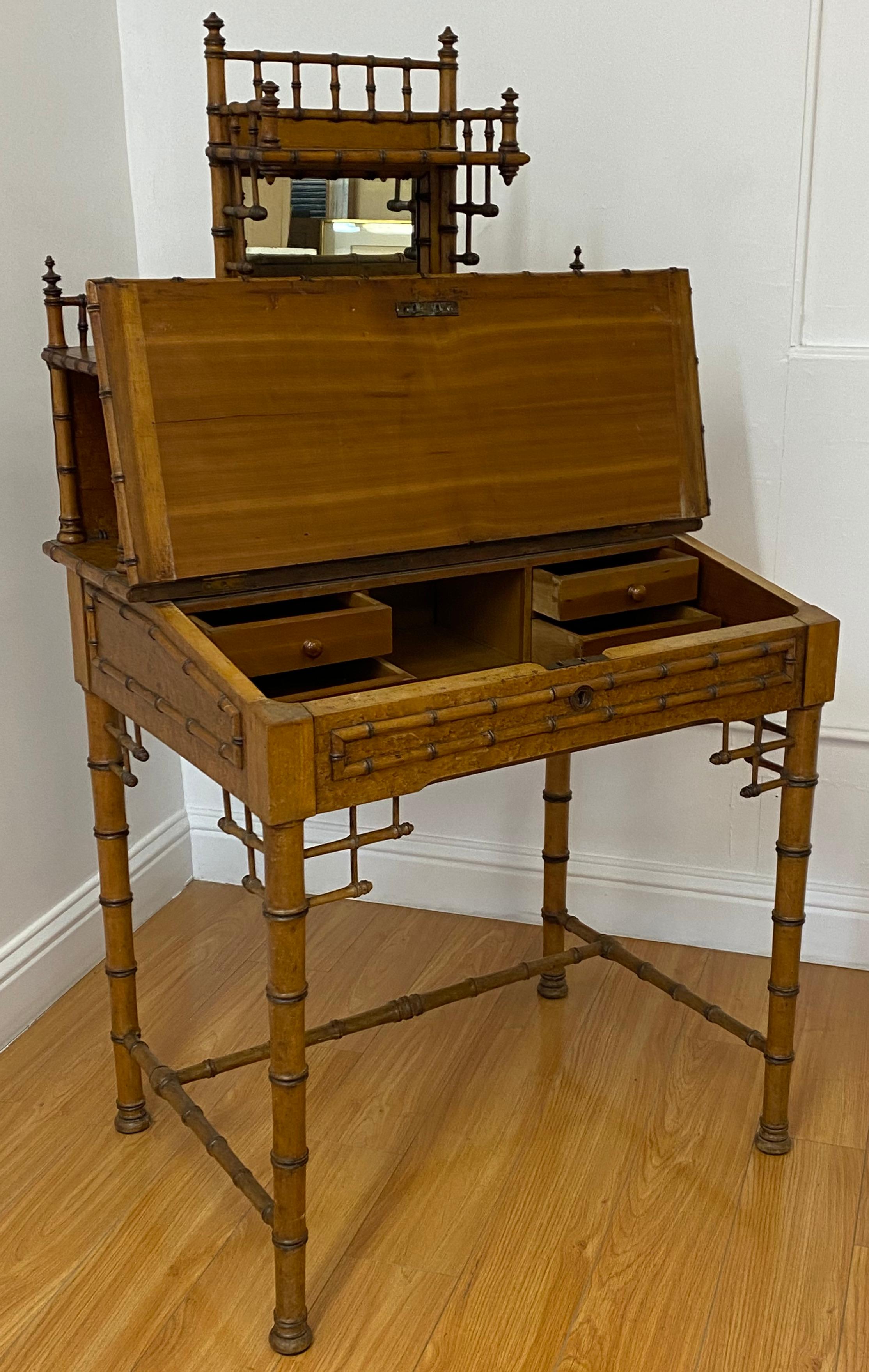 19th century bamboo & leather lift top writing desk

Outstanding antique bamboo writing desk with a lift top, leather surface, various shelves and a mirror.

This 19th century writing desk would make a great 21st century laptop